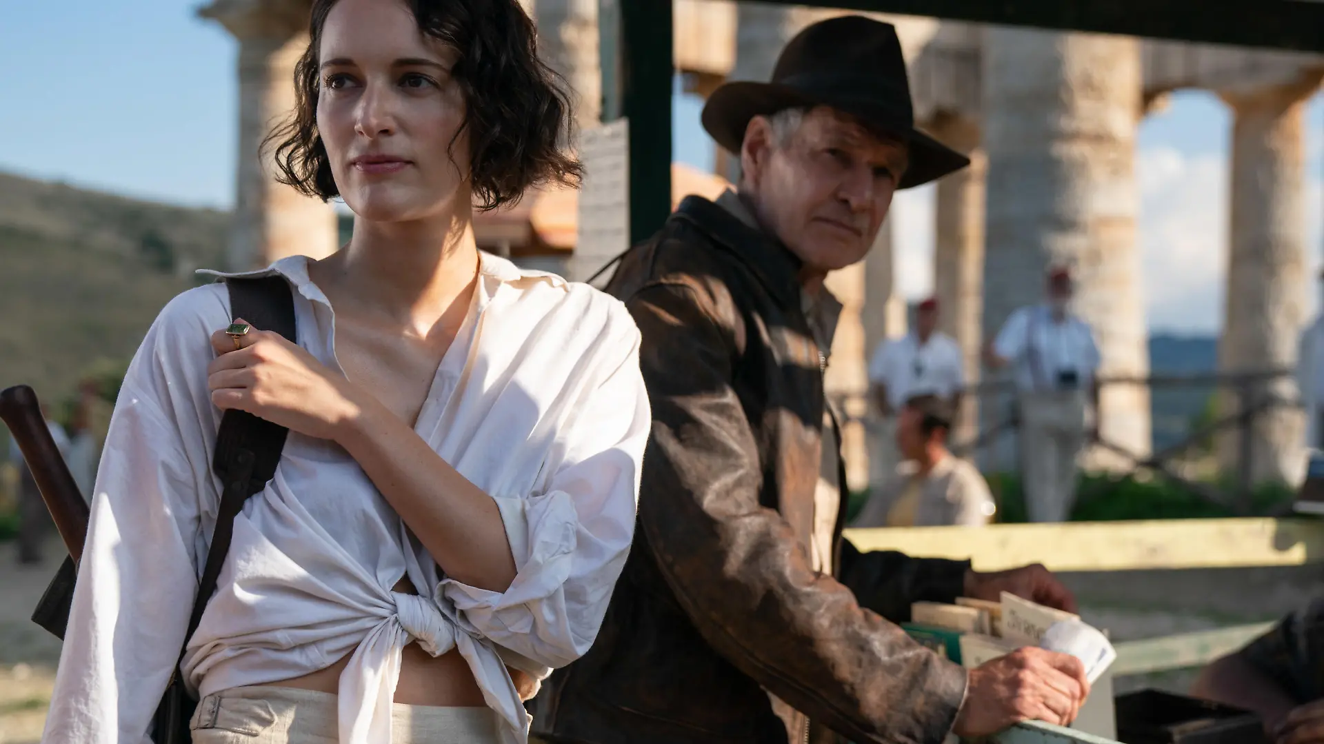 (L-R): Helena (Phoebe Waller-Bridge) and Indiana Jones (Harrison Ford) in Lucasfilm's Indiana Jones and the Dial of Destiny. ©2022 Lucasfilm Ltd. & TM. All Rights Reserved.