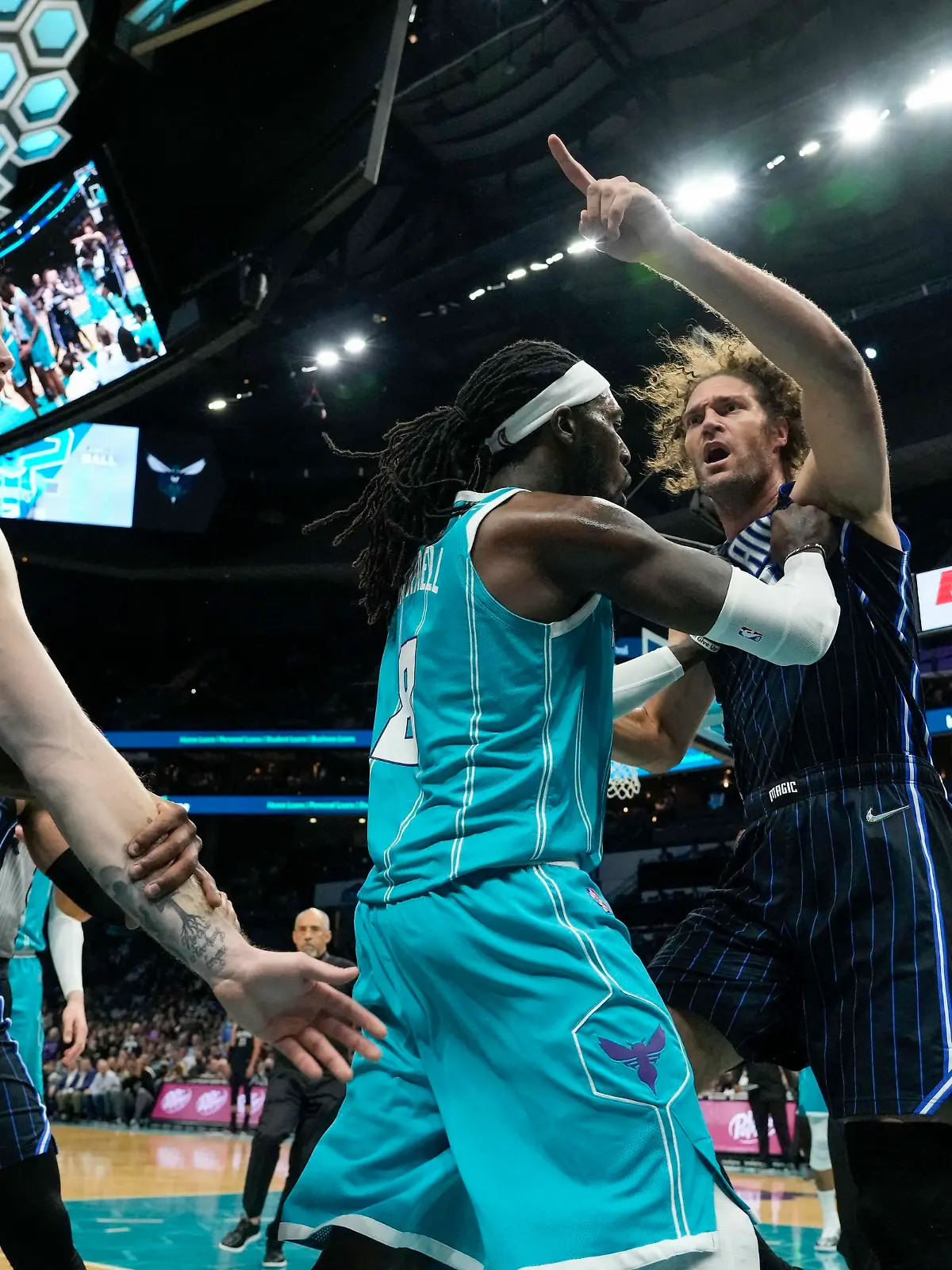 Apr 7, 2022; Charlotte, North Carolina, USA; Charlotte Hornets center Montrezl Harrell (8) tries to clear Orlando Magic center Robin Lopez (right) from an altercation that would later see both players ejected, as well as Magic forward Admiral Schofield (not pictured) during the second half at Spectrum Center. Mandatory Credit: Jim Dedmon-USA TODAY Sports