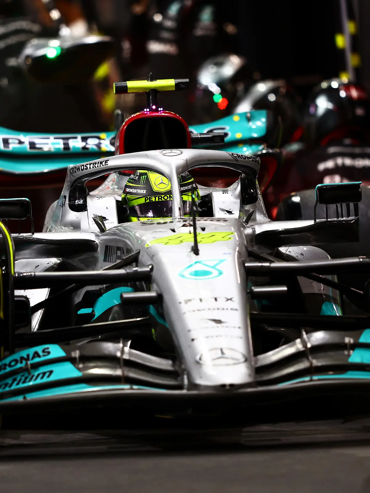 JEDDAH, SAUDI ARABIA - MARCH 27: Lewis Hamilton of Great Britain driving the (44) Mercedes AMG Petronas F1 Team W13 makes a pitstop during the F1 Grand Prix of Saudi Arabia at the Jeddah Corniche Circuit on March 27, 2022 in Jeddah, Saudi Arabia. (Photo by Mark Thompson/Getty Images)
