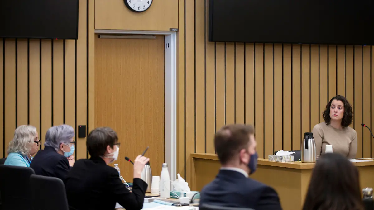 Witness Kathleen Dooley, at right, testifies at the murder trial of Nancy Crampton Brophy, seen far left with defense attorneys, on Monday, April 4, 2022. Dooley was a student at Oregon Culinary Institute, where Dan Brody was an instructor, at the time of the murder. The trial of the self-published romance writer accused of fatally shooting her chef husband started Monday. The trial is expected to last seven weeks. (Dave Killen/The Oregonian via AP, Pool)