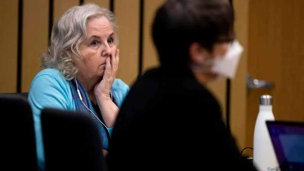 Nancy Crampton Brophy, left, accused of killing her husband Dan Brophy in June of 2018, is seen in court during her trial in Portland, Ore., Tuesday, April 5, 2022. The trial of the self-published romance writer accused of fatally shooting her chef husband started Monday. She has remained in custody since her arrest in September 2018, facing a murder charge in the death of Daniel Brophy, 63, The Oregonian/OregonLive reported. The trial is expected to last seven weeks. (Dave Killen/The Oregonian via AP, Pool)
