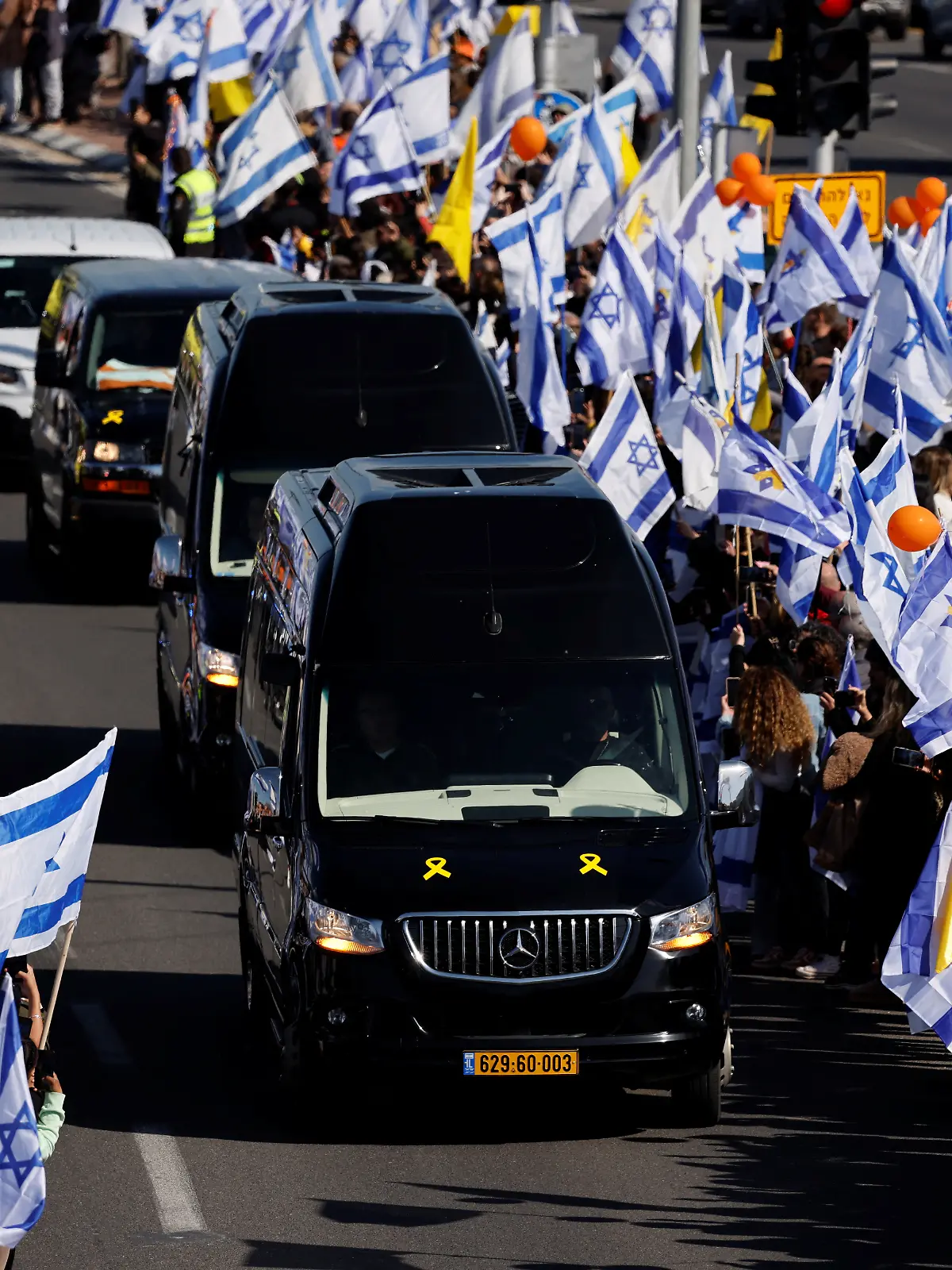 Israelis gather to bid farewell to Shiri, Ariel and Kfir Bibas, in Ashkelon