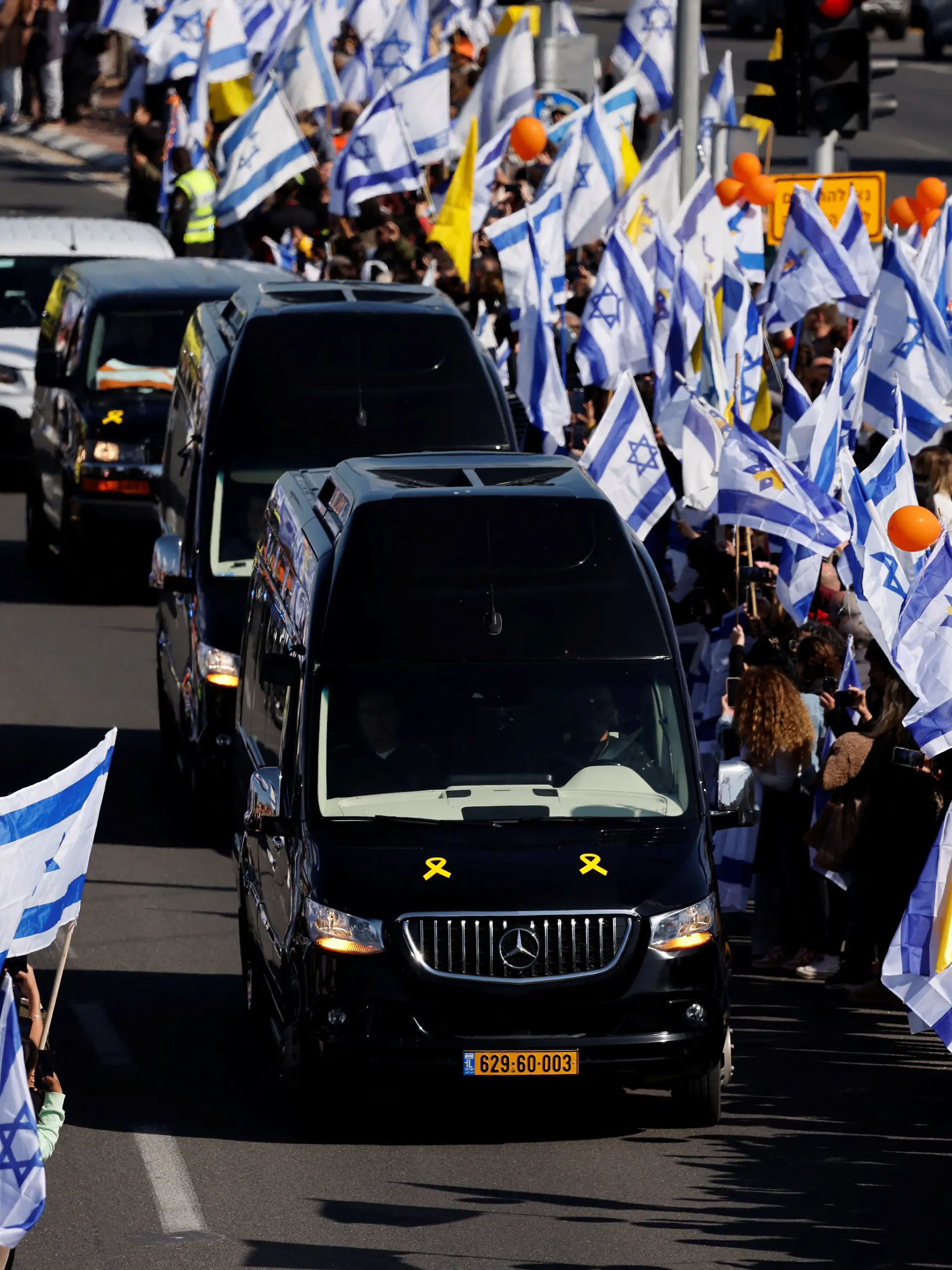 Israelis gather to bid farewell to Shiri, Ariel and Kfir Bibas, in Ashkelon