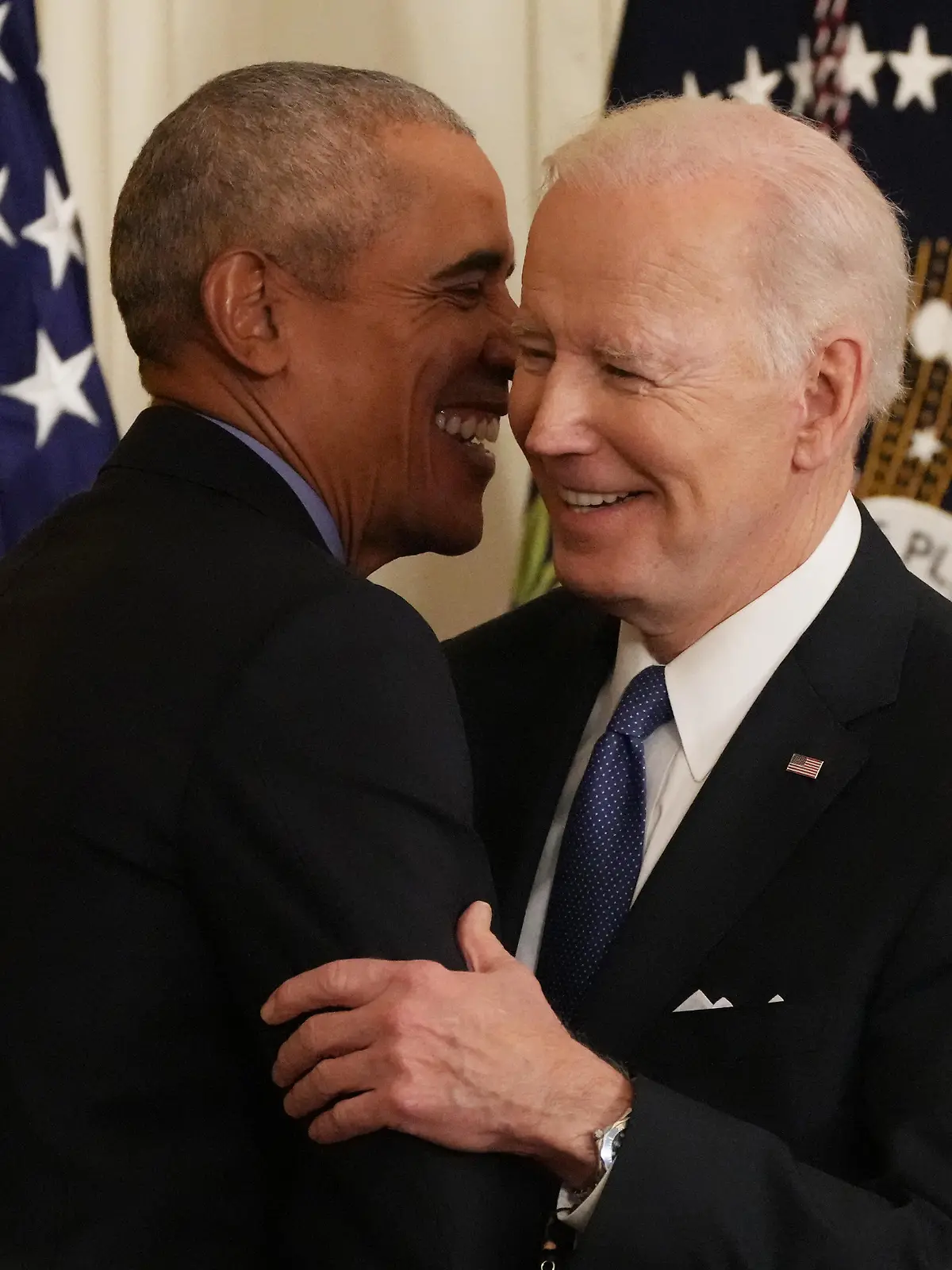 Former President Barack Obama hugs President Joe Biden as they join Vice President Kamala Harris (not seen) during a ceremony on the Affordable Care Act and lowering health care costs for families, at the White House in Washington, DC on Tuesday, April 5, 2022. Photo by Pat Benic/UPI Photo via Newscom picture alliance