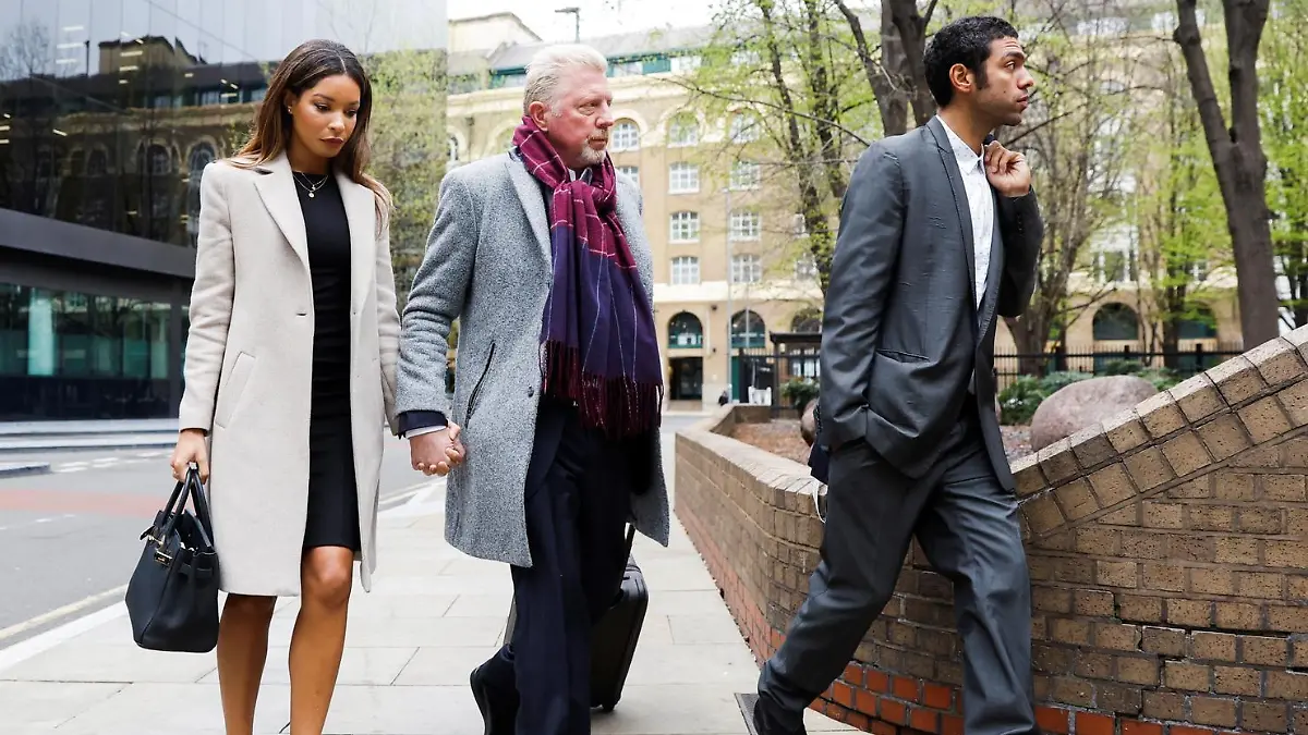 Former tennis player Boris Becker arrives with his partner Lilian de Carvalho Monteiro and his son Noah Becker at Southwark Crown Court for his bankruptcy offences trial in London, Britain, April 8, 2022. REUTERS/Peter Cziborra