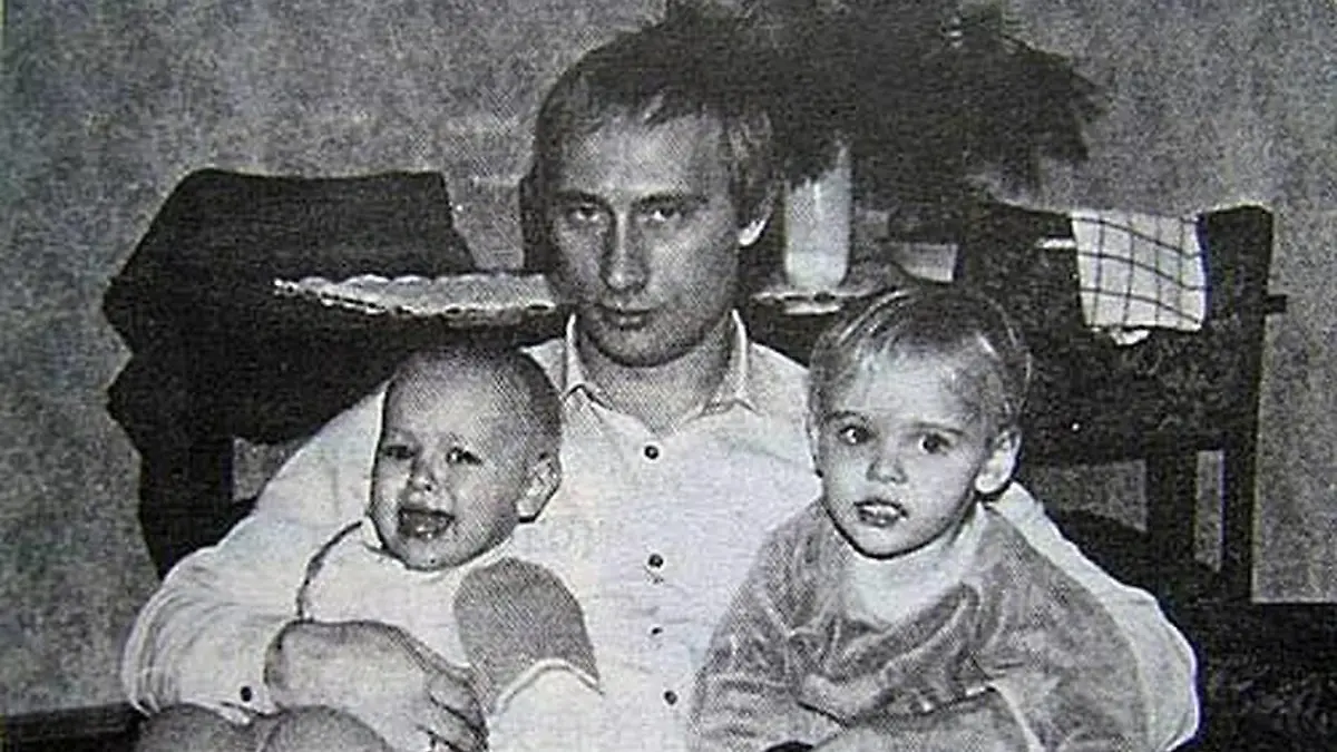 Before rising to power as one of the most infamous leaders in the world, Putin was a playful, hipster-dressing man in love. circa 1989, Russia: A young VLADIMIR PUTIN with his daughters. St. Petersburg Russia - ZUMAz03_ 19890202_smk_z03_759 Copyright: xRussianxArchivesx