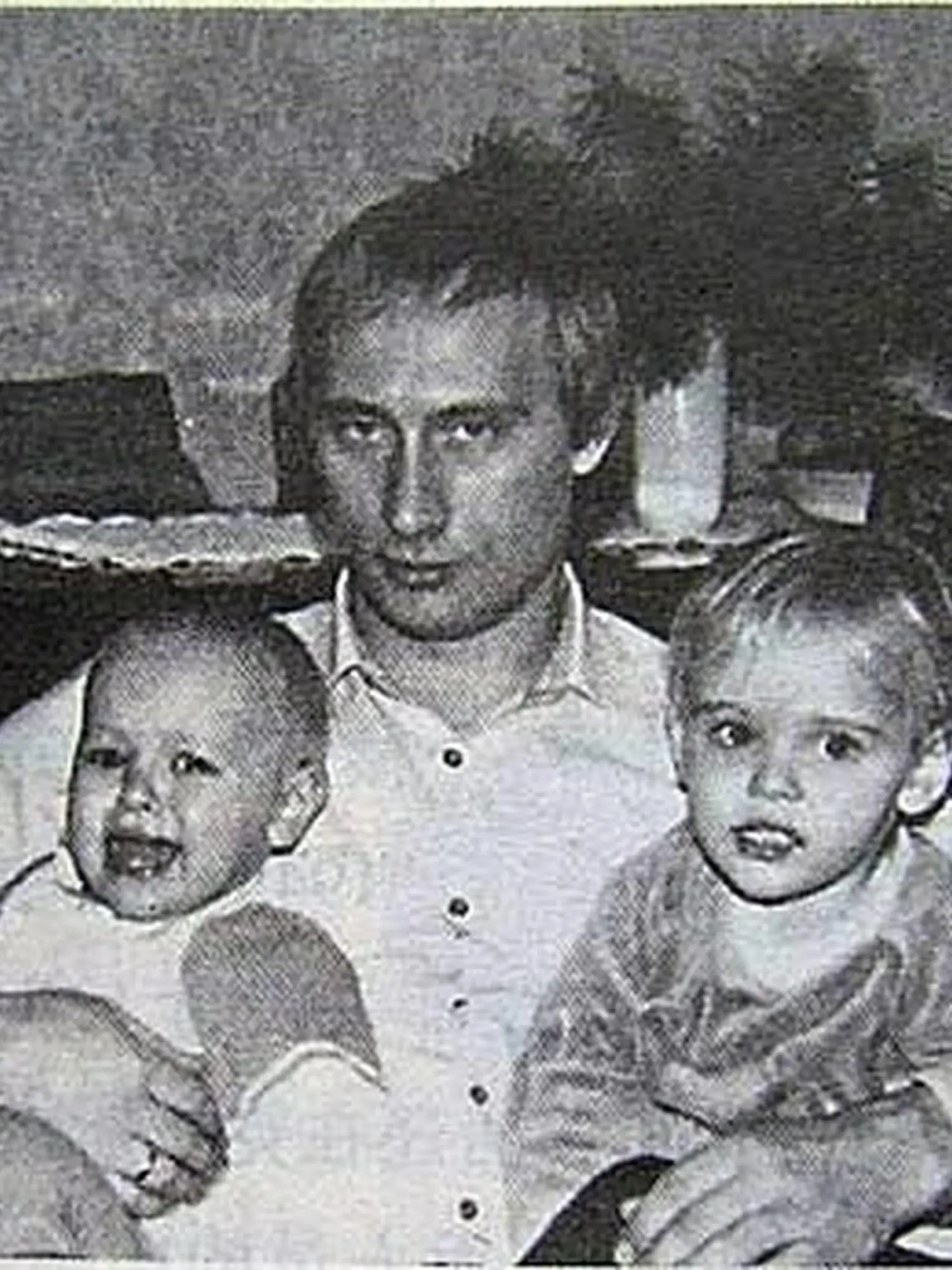 Before rising to power as one of the most infamous leaders in the world, Putin was a playful, hipster-dressing man in love. circa 1989, Russia: A young VLADIMIR PUTIN with his daughters. St. Petersburg Russia - ZUMAz03_ 19890202_smk_z03_759 Copyright: xRussianxArchivesx 