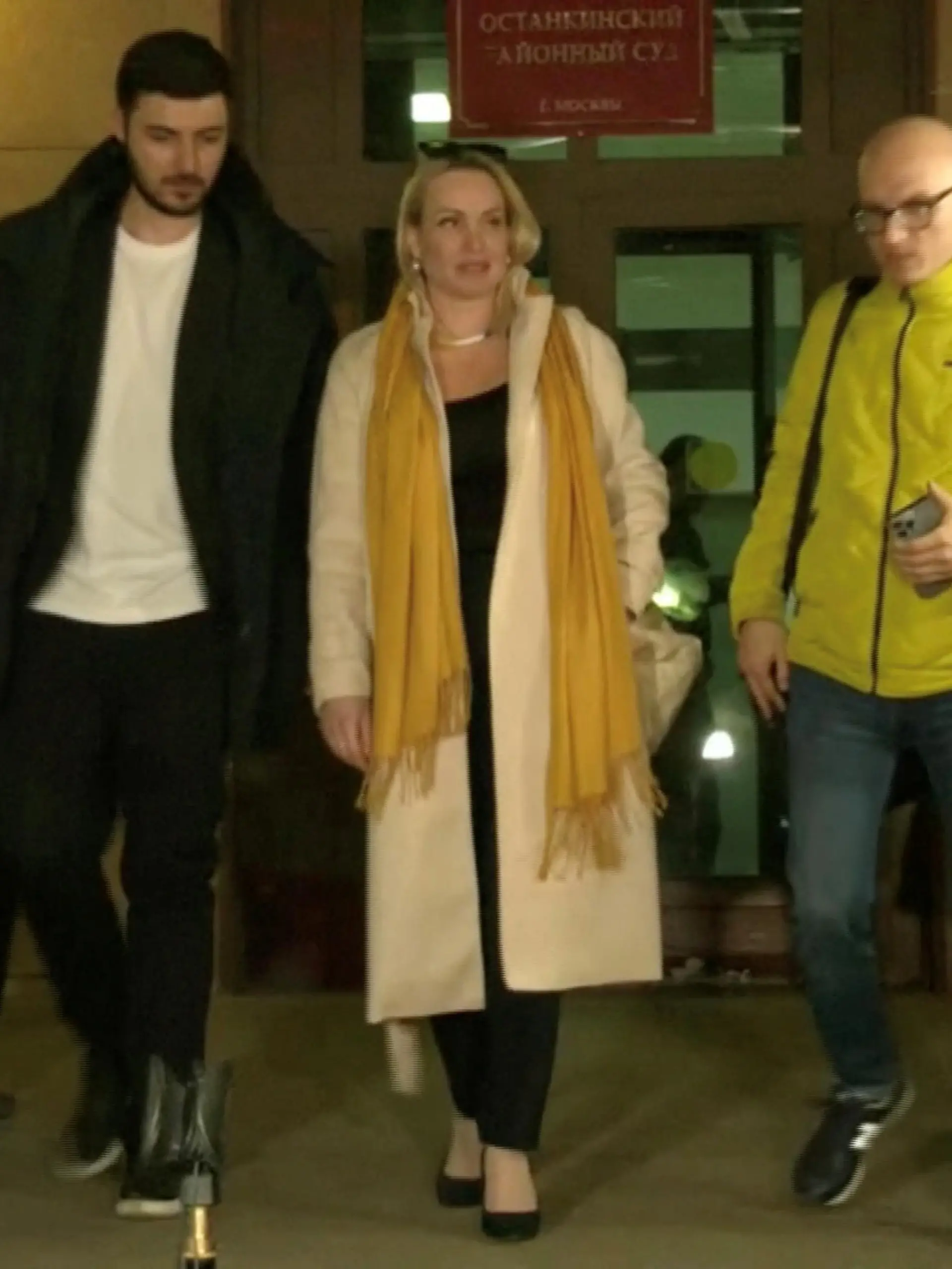Marina Ovsyannikova, a Channel One employee who staged an on-air protest as she held up a anti-war sign behind a studio presenter, leaves the court building in Moscow, Russia March 15, 2022 in this still image taken from a video. REUTERS TV via REUTERS