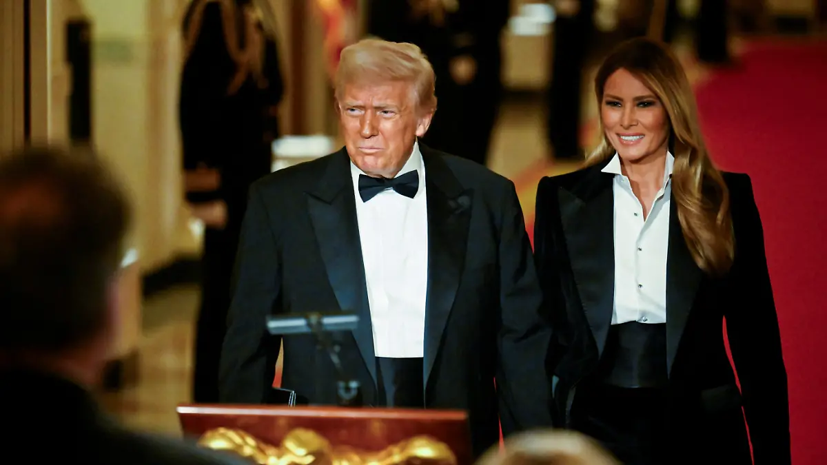U.S. President Donald Trump and U.S. First Lady Melania Trump arrive for the National Governors Association (NGA) dinner and reception in the East Room at the White House in Washington, D.C., U.S., February 22, 2025. REUTERS/Craig Hudson