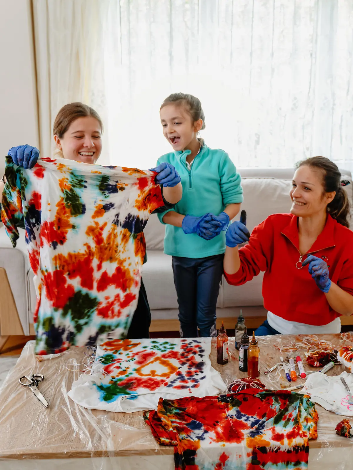 Family making tie dye together