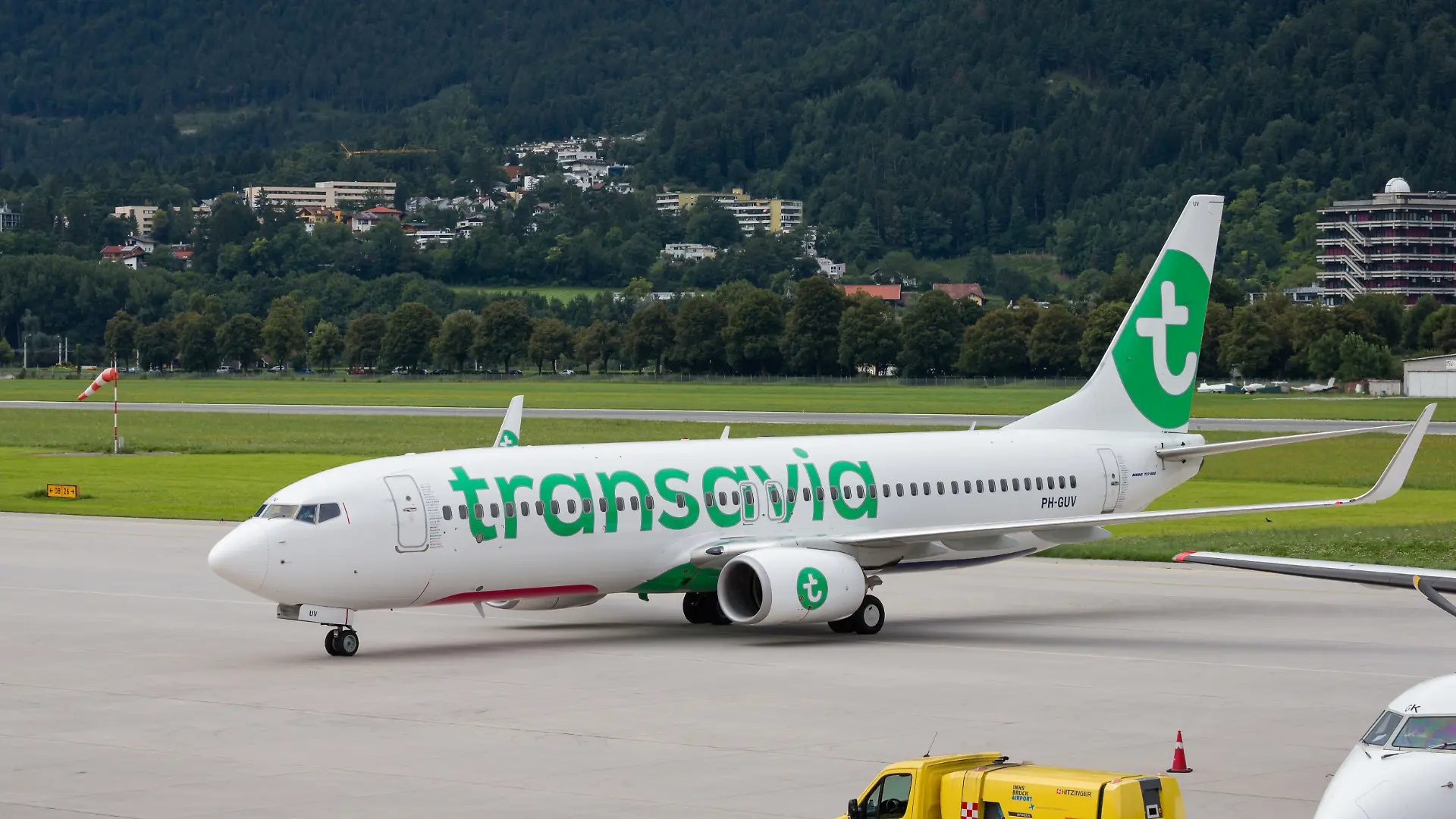 Innsbruck, Tyrol, Austria, august 12th 2016, daytime side view close-up of a Transavia Boeing 737-800 that has just landed at Innsbruck Airport - Transavia Airlines C.V. is a Dutch, Amsterdam based low-cost airline owned by KLM Royal Dutch Airlines - the 737-800 is a third generation Boeing 737 and was launched in 1998