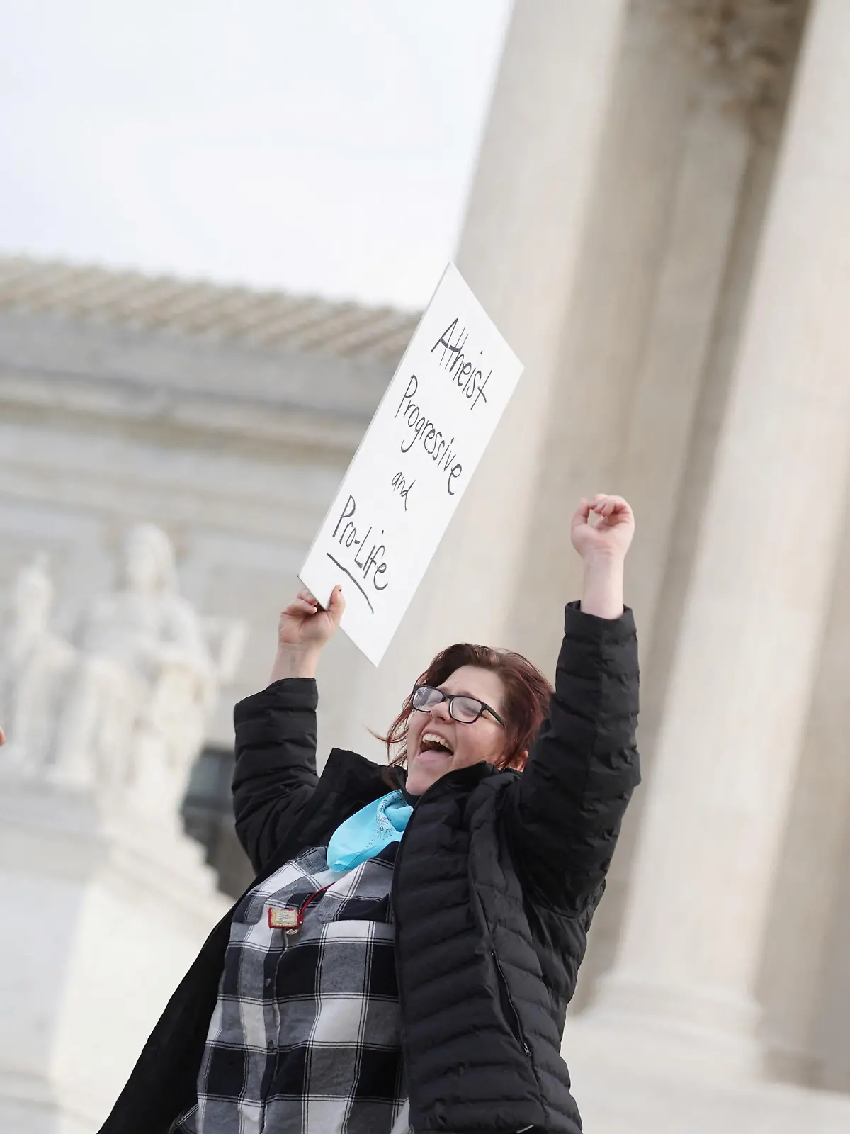 FILE PHOTO: Anti-abortion activist Lauren Handy chant slogans after justices allowed abortion providers to pursue a legal challenge to a ban on most abortions in Texas, outside the U.S. Supreme Court in Washington, U.S., December 10, 2021. REUTERS/Sarah Silbiger/File Photo