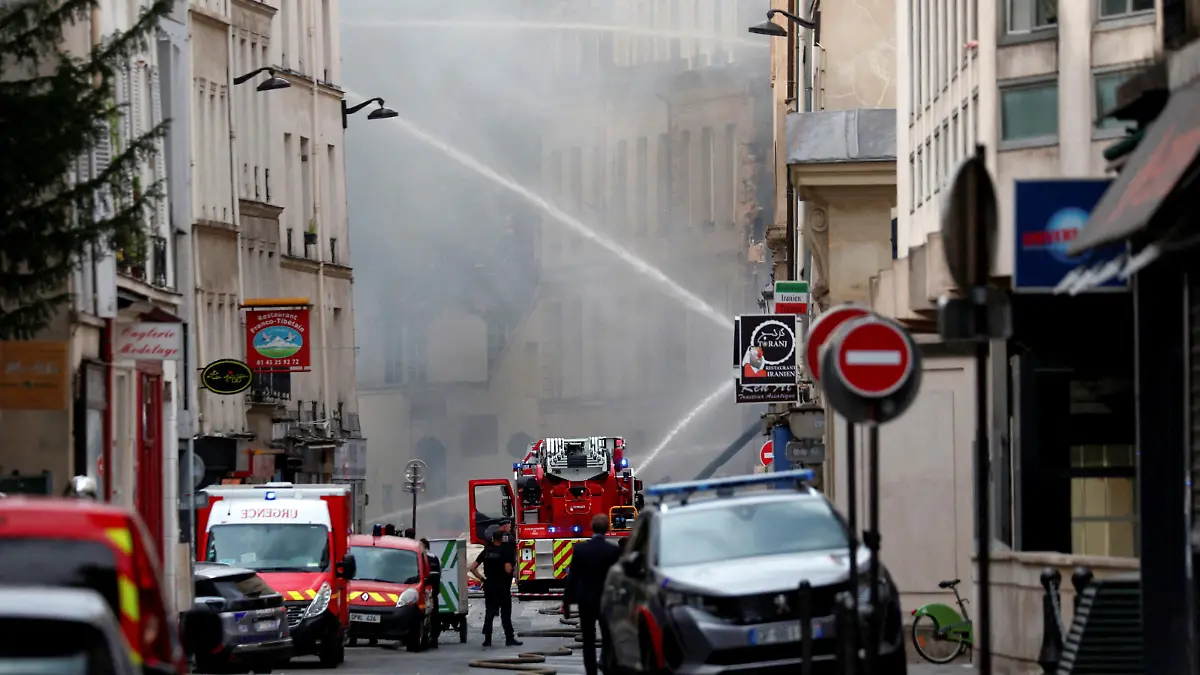 French firefighters work after several buildings on fire following a gas explosion in the fifth arrondissement of Paris, France, June 21, 2023. REUTERS/Gonzalo Fuentes TPX IMAGES OF THE DAY