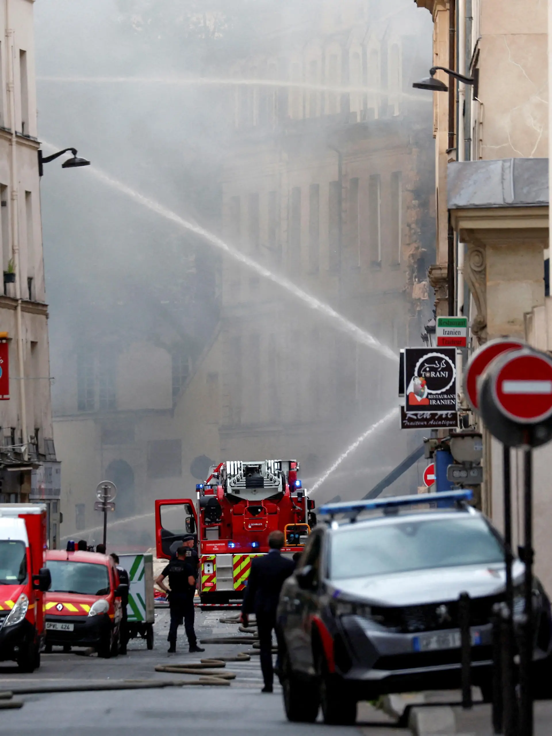 French firefighters work after several buildings on fire following a gas explosion in the fifth arrondissement of Paris, France, June 21, 2023. REUTERS/Gonzalo Fuentes     TPX IMAGES OF THE DAY