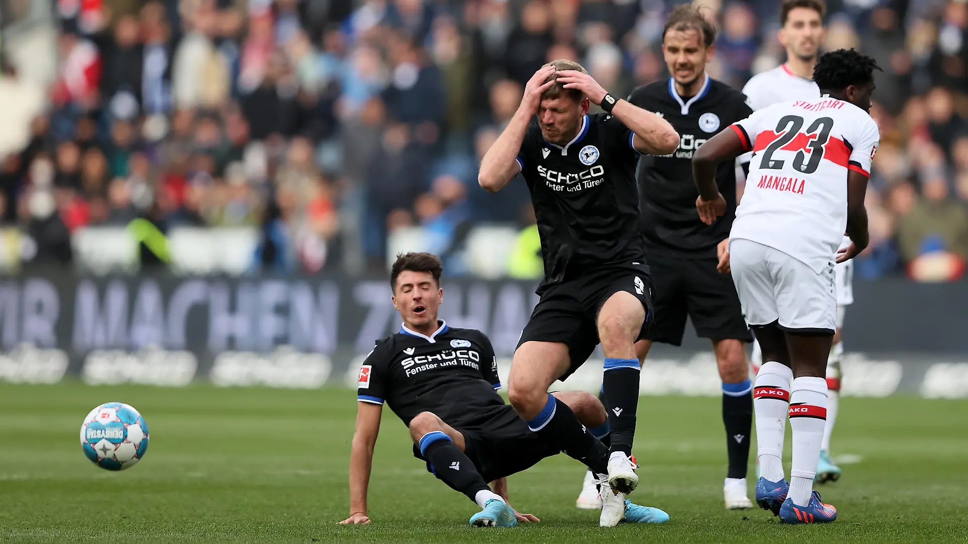 BIELEFELD, GERMANY - APRIL 02: Fabian Klos after clashing with team mate Alessandro Schoepf of DSC Arminia Bielefeld in the air during the Bundesliga match between DSC Arminia Bielefeld and VfB Stuttgart at Schueco Arena on April 02, 2022 in Bielefeld, Germany. (Photo by Martin Rose/Getty Images)