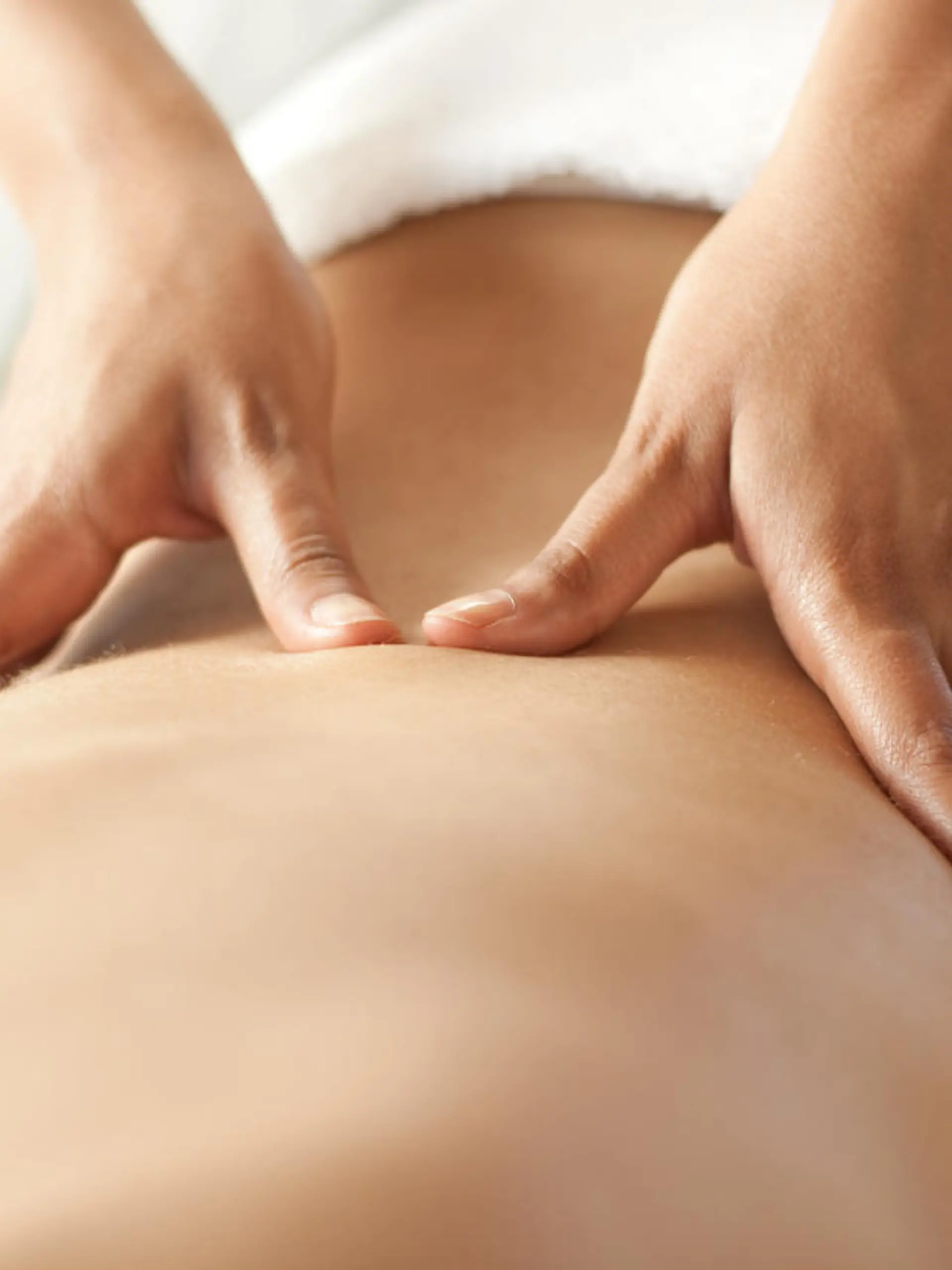 Hands massaging lower back. You may also like: