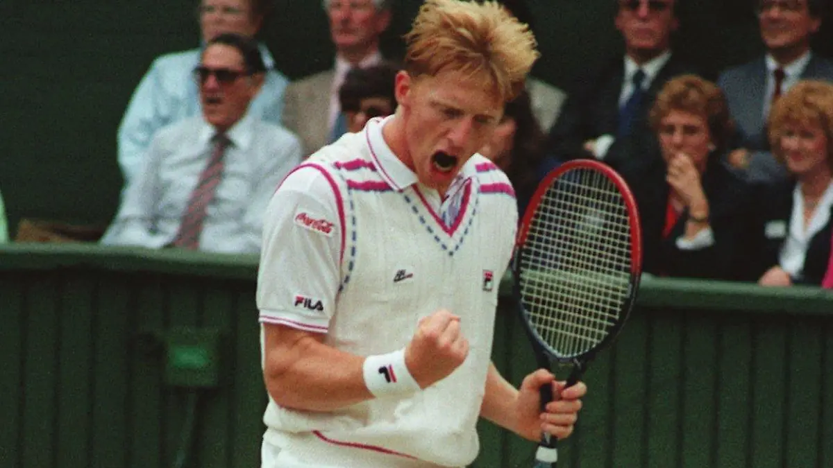 Boris Becker celebrates his victory over Stefan Edberg in the men's singles final at Wimbledon, July 9, 1989. (AP Photo/John Redman)