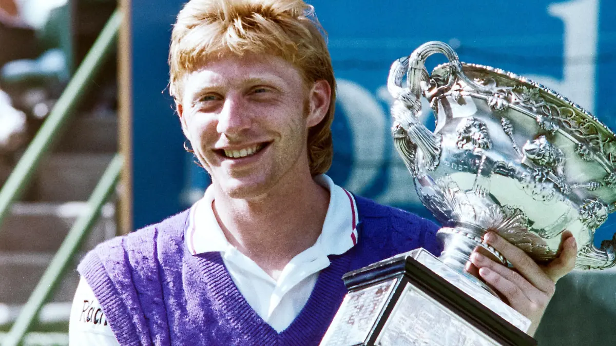  910127 Tennis, Australian Open: Boris Becker of Germany celebrates with the trophy after defeating Czech Republics Ivan Lendl in the Australian Open final on January 27, 1991 in Melbourne, Australia. BILDBYRAN *** 910127 Tennis, Australian Open Boris Becker of Germany celebrates with the trophy after defeating Czech Republics Ivan Lendl in the Australian Open final on January 27, 1991 in Melbourne, Australia BILDBYRAN, PUBLICATIONxNOTxINxSWExNORxAUT Copyright: ARNExFORSELL BB910127BB014
