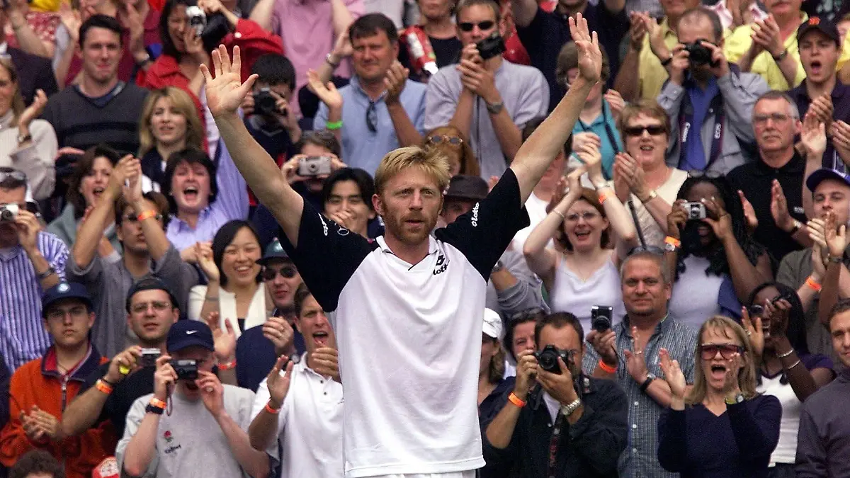 Boris Becker responds to the applause of the crowd, at the end of his Men's Singles, fourth round match against Australia's Patrick Rafter on the Centre Court at Wimbledon Wednesday, June 30, 1999. Rafter defeated Becker, who is reportedly making his last appearance at Wimbledon, 6-3, 6-2, 6-3. (AP Photo/Dave Caulkin)
