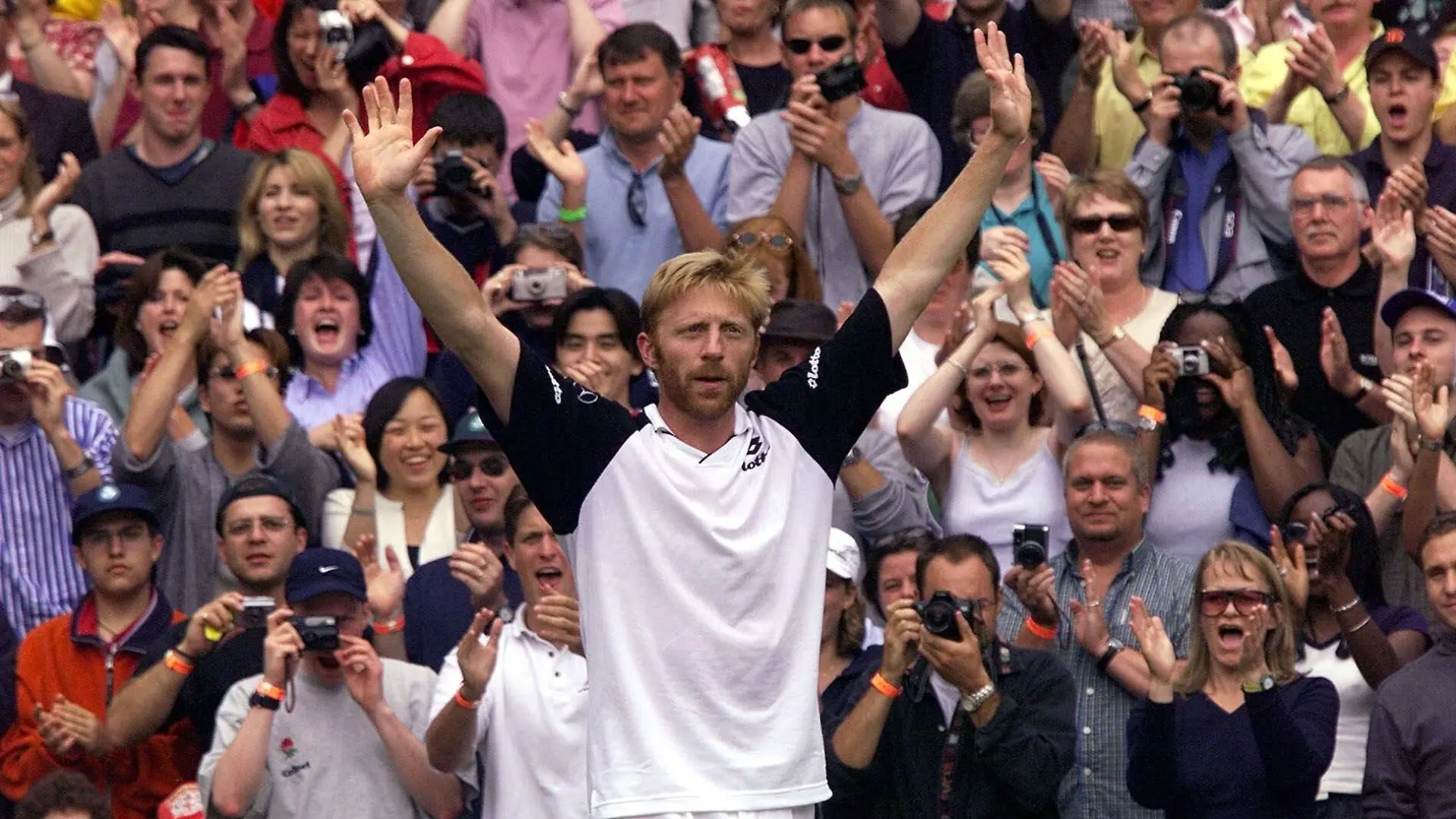 Boris Becker responds to the applause of the crowd, at the end of his Men's Singles, fourth round match against Australia's Patrick Rafter on the Centre Court at Wimbledon Wednesday, June 30, 1999. Rafter defeated Becker, who is reportedly making his last appearance at Wimbledon, 6-3, 6-2, 6-3. (AP Photo/Dave Caulkin)