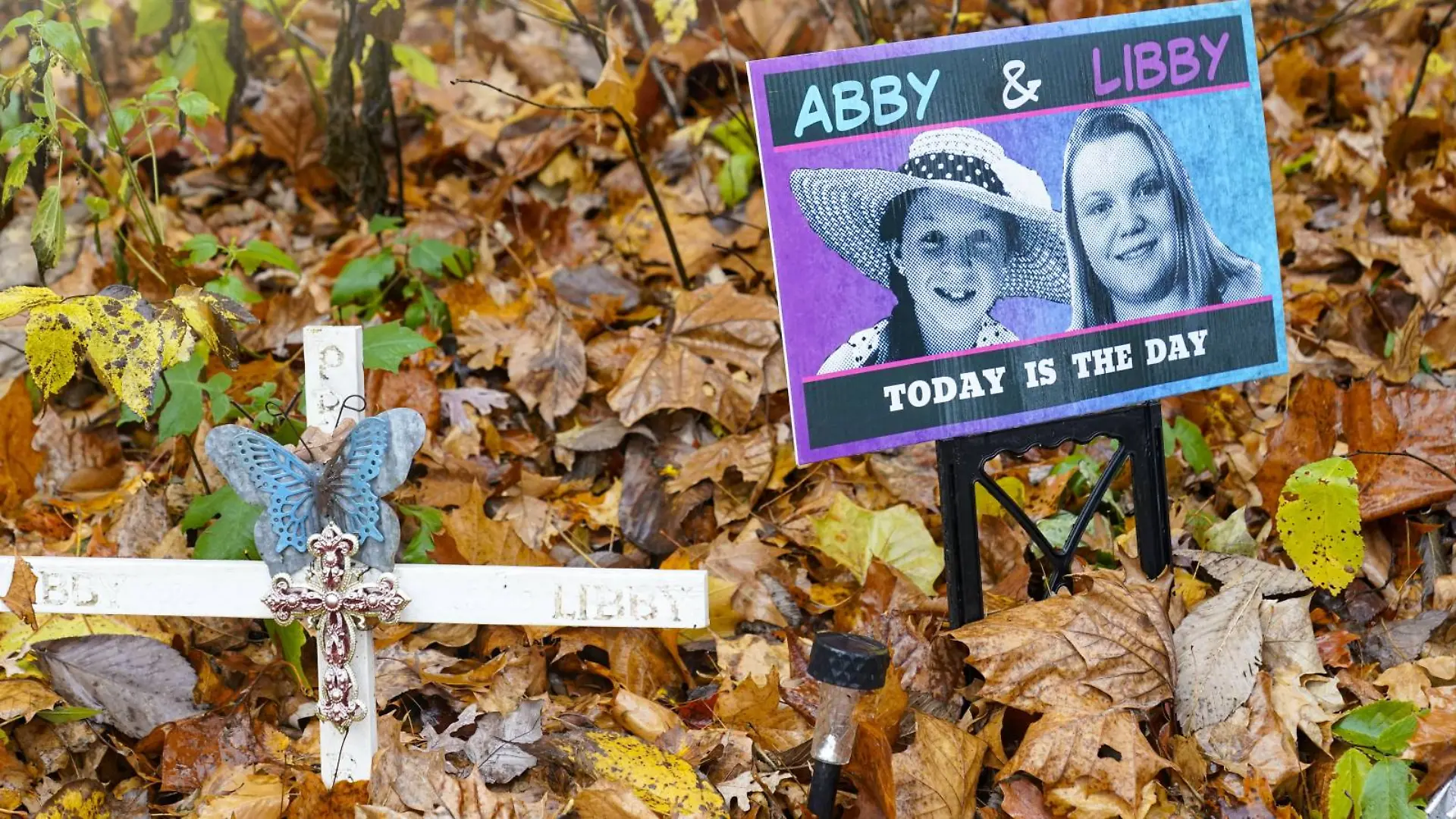 FILE - A makeshift memorial to Liberty German and Abigail Williams near where they were last seen and where the bodies were discovered stands along the Monon Trail leading to the Monon High Bridge Trail in Delphi, Ind., Oct. 31, 2022. A man charged with killing the two teenage girls will remain held at a northern Indiana prison after a judge concluded Wednesday, July 19, 2023, he’s being treated better there than other inmates, after attorneys for Richard Allen requested to relocate him from the Indiana Department of Correction’s Westville Correctional Facility. (AP Photo/Michael Conroy, File)

