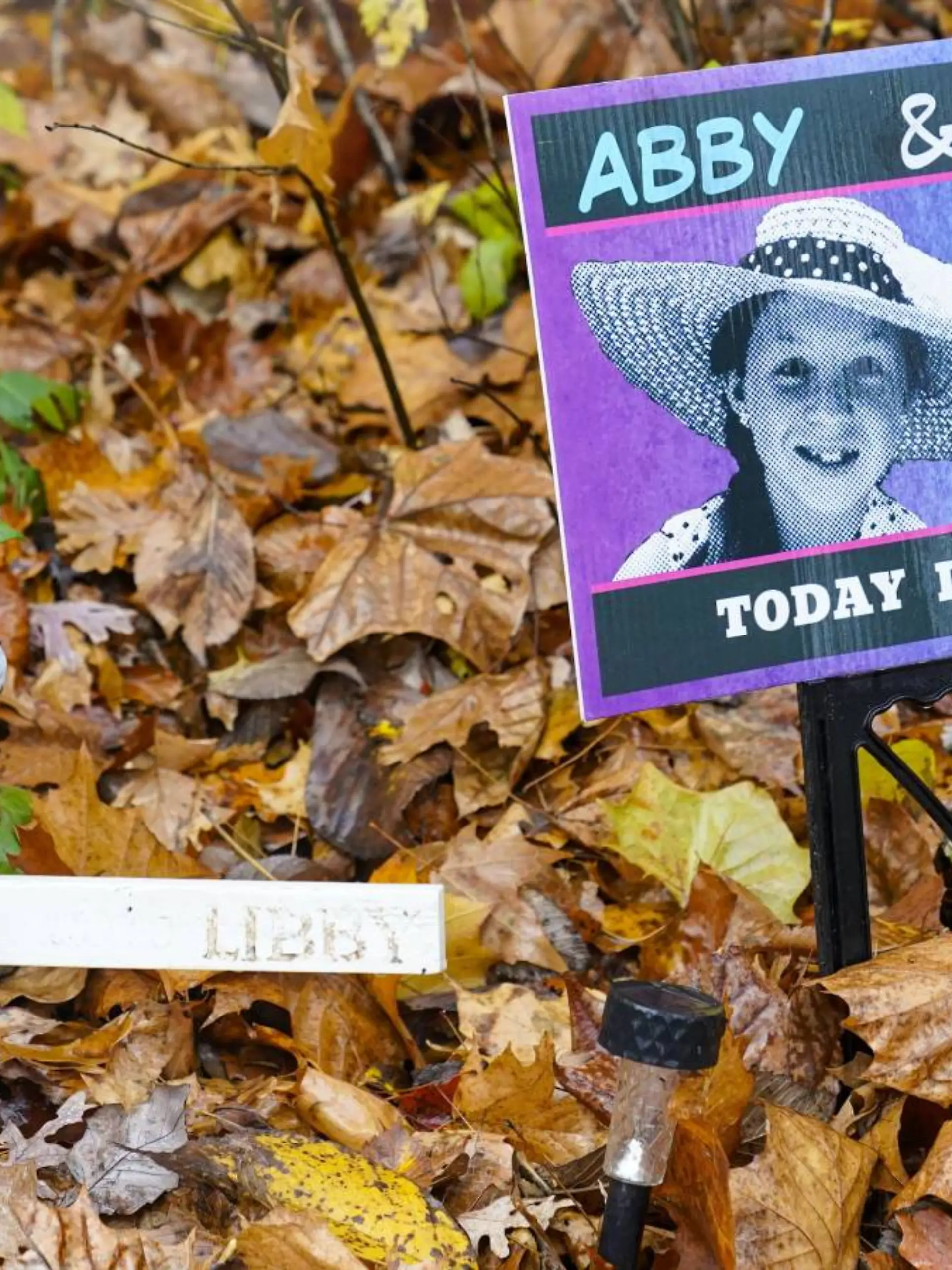 FILE - A makeshift memorial to Liberty German and Abigail Williams near where they were last seen and where the bodies were discovered stands along the Monon Trail leading to the Monon High Bridge Trail in Delphi, Ind., Oct. 31, 2022. A man charged with killing the two teenage girls will remain held at a northern Indiana prison after a judge concluded Wednesday, July 19, 2023, he’s being treated better there than other inmates, after attorneys for Richard Allen requested to relocate him from the Indiana Department of Correction’s Westville Correctional Facility. (AP Photo/Michael Conroy, File)
