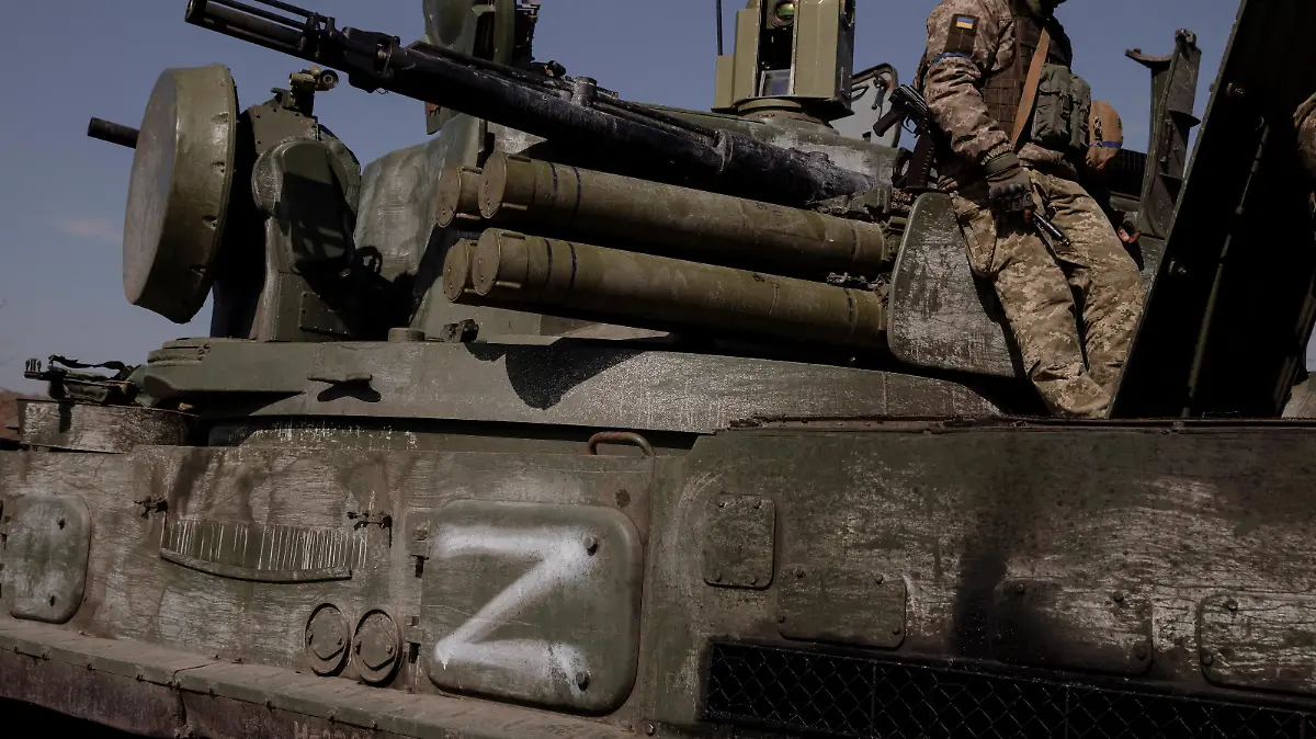 FILE PHOTO: A Ukrainian soldier sits on top of a Russian artillery vehicle marked with the 'Z' symbol, which Ukraine captured during fighting outside Kharkiv, as Russia's attack on Ukraine continues, Ukraine, March 29, 2022. REUTERS/Thomas Peter/File Photo