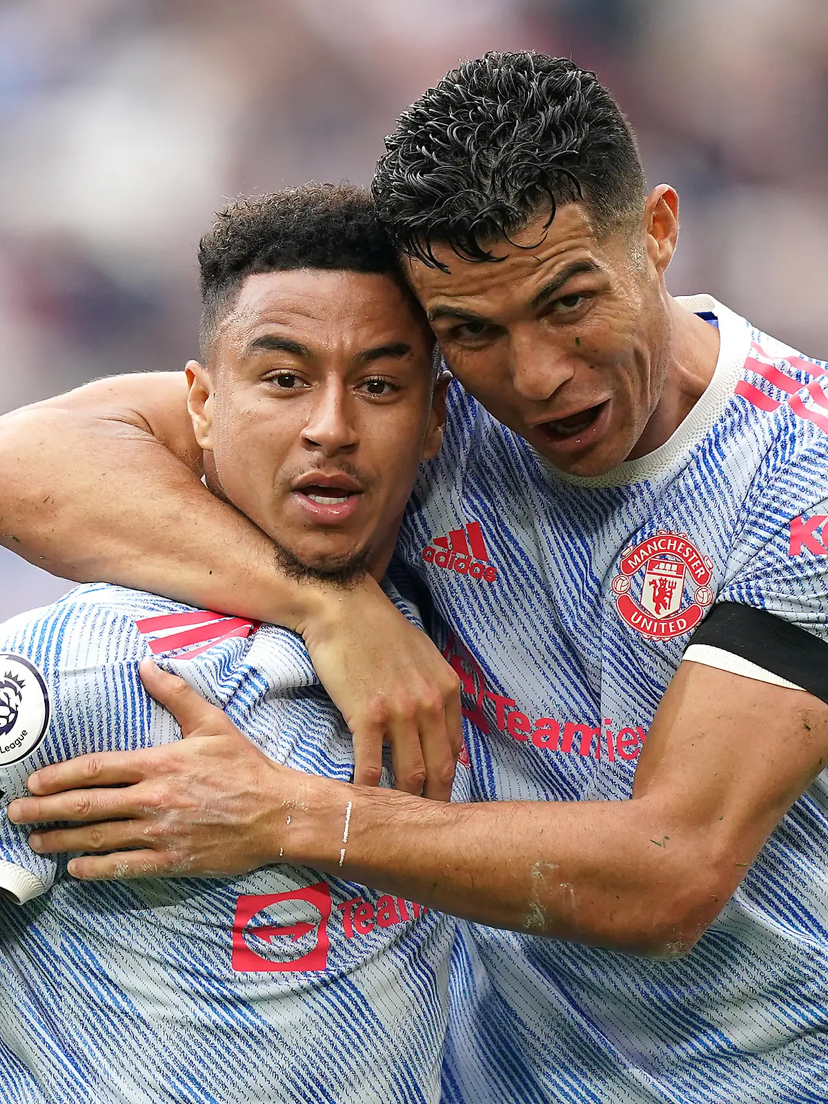 West Ham United v Manchester United - Premier League - London Stadium. Manchester United's Jesse Lingard (left) celebrates scoring their side's second goal of the game with Cristiano Ronaldo during the Premier League match at the London Stadium, London. Picture date: Sunday September 19, 2021. See PA story SOCCER West Ham. Photo credit should read: Mike Egerton/PA Wire. RESTRICTIONS: EDITORIAL USE ONLY No use with unauthorised audio, video, data, fixture lists, club/league logos or "live" services. Online in-match use limited to 120 images, no video emulation. No use in betting, games or single club/league/player publications. URN:62524781