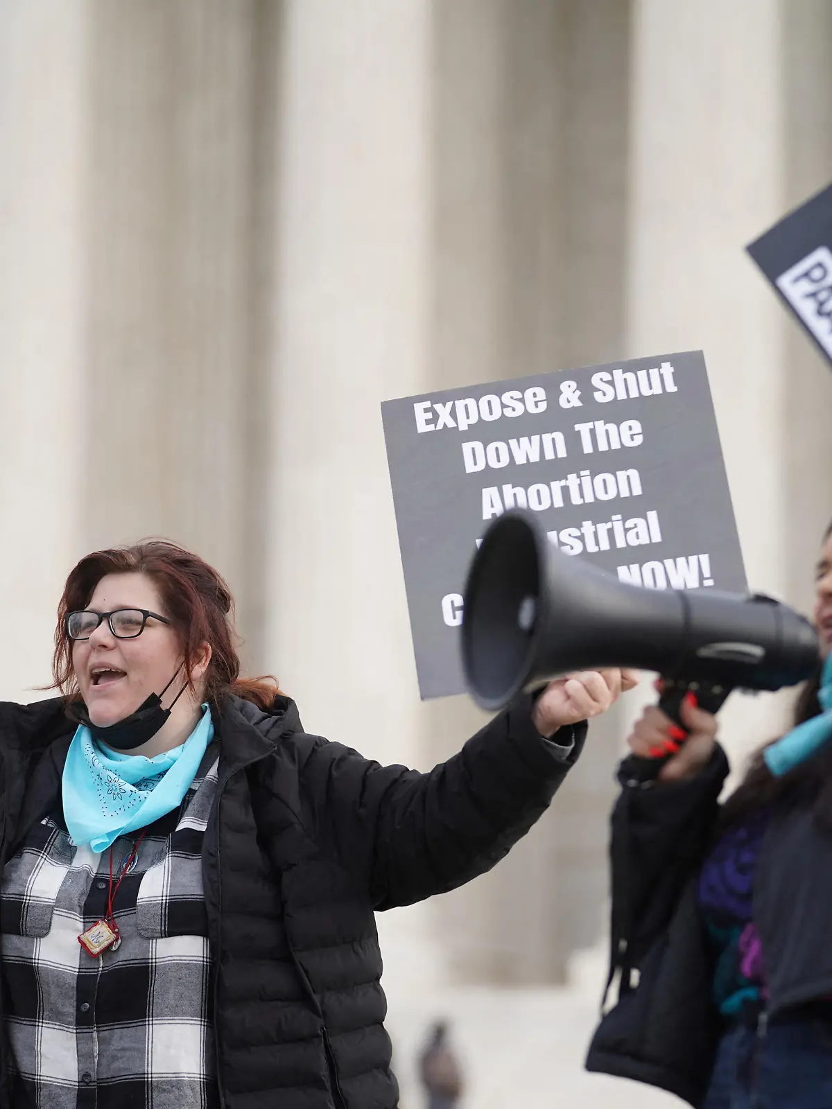 FILE PHOTO: Anti-abortion activists Lauren handy and Terrisa Bukovinac chant slogans after justices allowed abortion providers to pursue a legal challenge to a ban on most abortions in Texas, outside the U.S. Supreme Court in Washington, U.S., December 10, 2021. REUTERS/Sarah Silbiger/File Photo