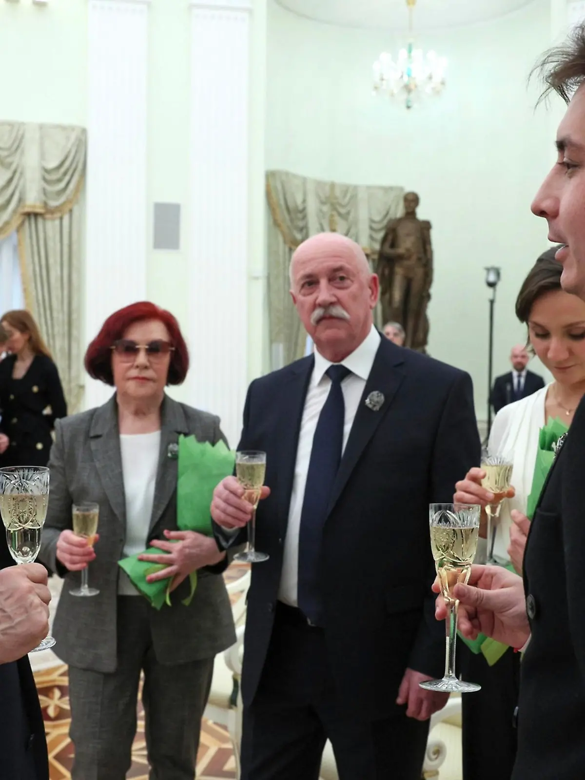 March 22, 2023, Moscow, Moscow Oblast, Russia: Russian President Vladimir Putin, left, shares a glass of champagne with the winners of the 2022 Presidential Prize at the Kremlin Palace, March 22, 2023 in Moscow, Russia. Standing from left: Vladimir Putin, Larisa Feoktistova, Viktor Gotsulenko, Ekaterina Pilnikova, and Aidar Zabbarov. (Credit Image: Â© Gavriil Grigorov/Kremlin Pool/Planet Pix via ZUMA Press Wire