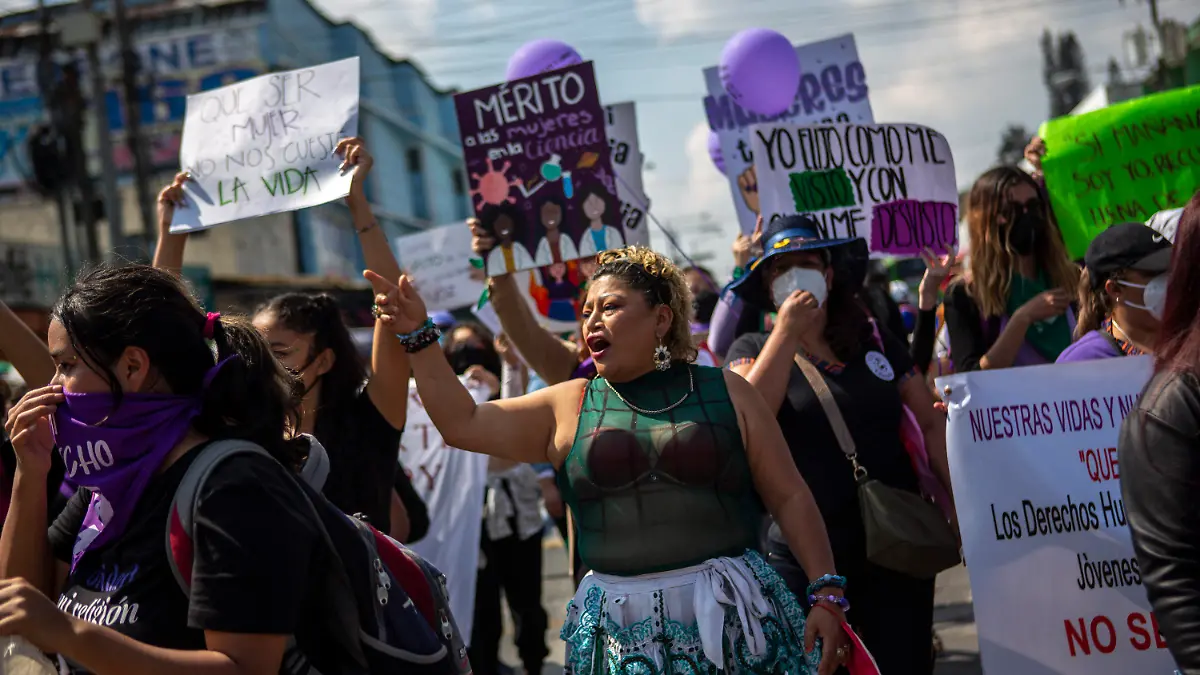 Women participate in a demonstration marking International Women's Day in downtown Guatemala City, Tuesday, March 8, 2022. (AP Photo/Oliver de Ros)