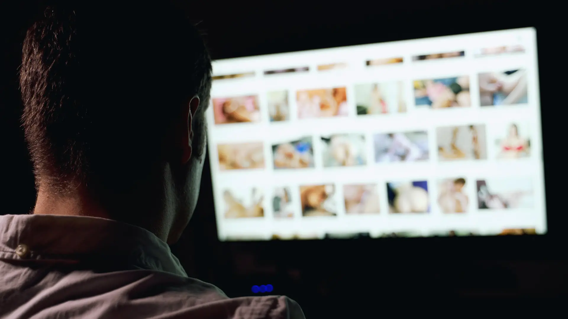 Man browsing porn site late at night.