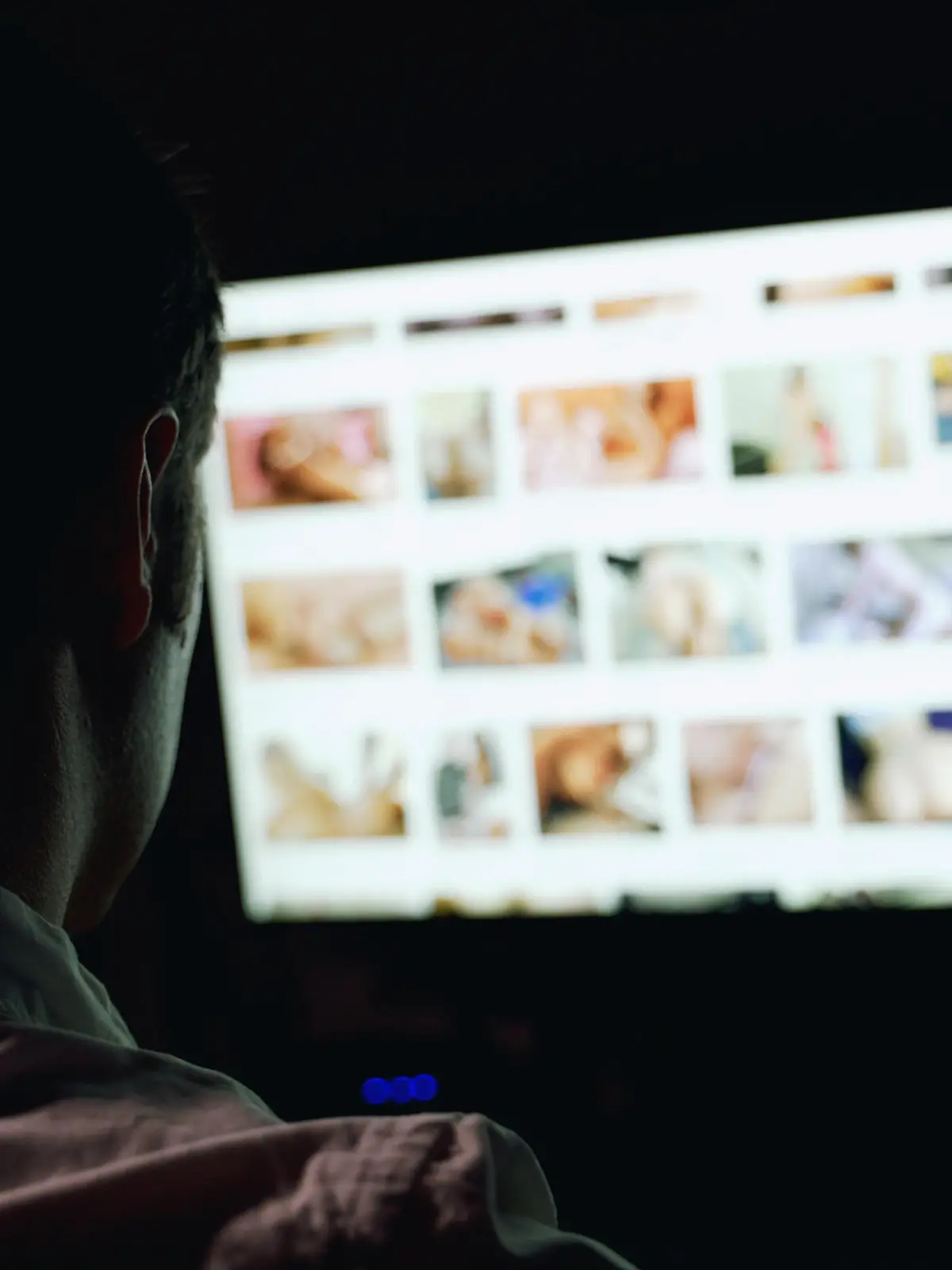Man browsing porn site late at night.