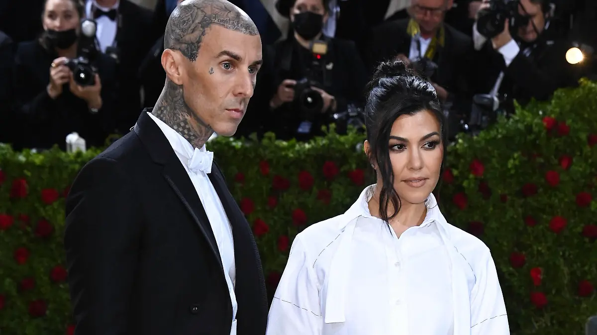 Photo by: DPRF/STAR MAX/IPx 2022 5/22/22 Kourtney Kardashian and Travis Barker wed in Italy. STAR MAX File Photo: 5/2/22 Travis Barker and Kourtney Kardashian at the 2022 Costume Institute Benefit Gala celebrating the opening of "In America: An Anthology of Fashion" held on May 2, 2022 at The Metropolitan Museum of Art in New York City.