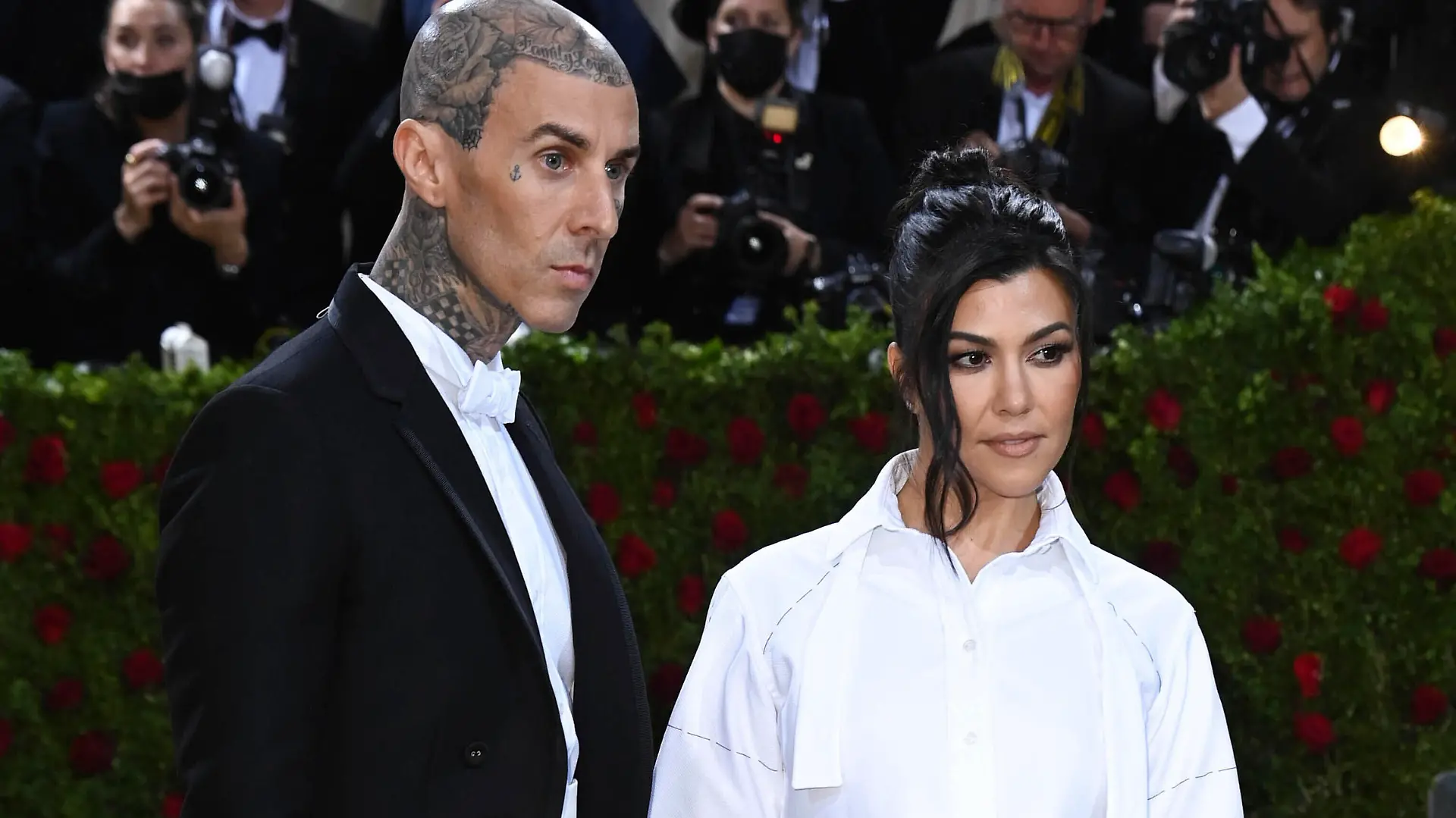 Photo by: DPRF/STAR MAX/IPx 2022 5/22/22 Kourtney Kardashian and Travis Barker wed in Italy. STAR MAX File Photo: 5/2/22 Travis Barker and Kourtney Kardashian at the 2022 Costume Institute Benefit Gala celebrating the opening of "In America: An Anthology of Fashion" held on May 2, 2022 at The Metropolitan Museum of Art in New York City.