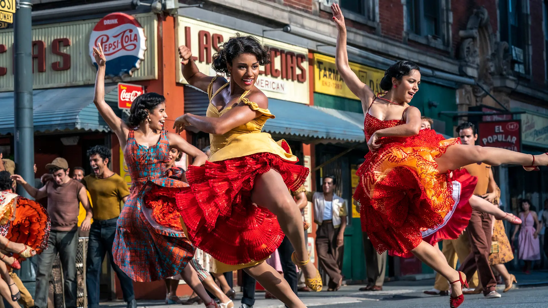 This image released by 20th Century Studios shows, from left, Ilda Mason as Luz, Ariana DeBose as Anita, and Ana Isabelle as Rosalia in "West Side Story." (Niko Tavernise/20th Century Studios via AP)