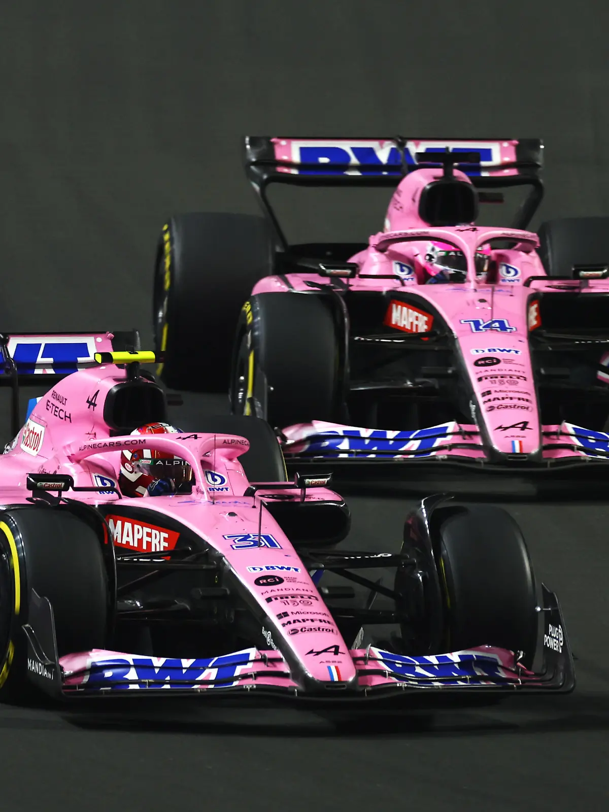 JEDDAH, SAUDI ARABIA - MARCH 27: Esteban Ocon of France driving the (31) Alpine F1 A522 Renault leads Fernando Alonso of Spain driving the (14) Alpine F1 A522 Renault on track during the F1 Grand Prix of Saudi Arabia at the Jeddah Corniche Circuit on March 27, 2022 in Jeddah, Saudi Arabia. (Photo by Lars Baron/Getty Images)