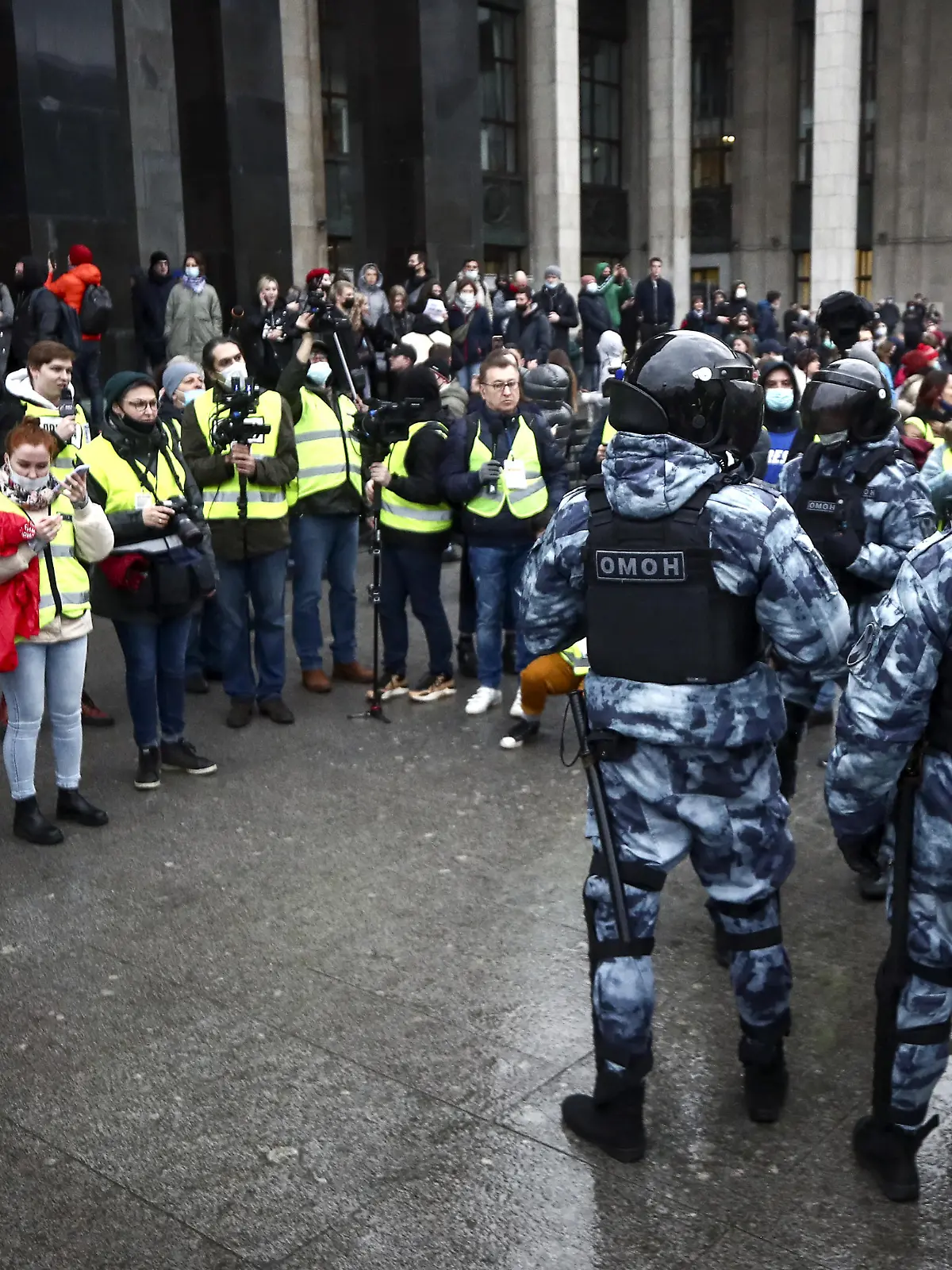 MOSCOW, RUSSIA  APRIL 21, 2021: OMON officers (R) and journalists are seen during an unsanctioned rally by supporters of opposition activist Navalny outside the Russian State Library. In February 2021, Navalny had his suspended sentence in the Yves Rocher case converted to a real jail term of three and a half years and sent to a prison colony. On 31 March 2021, Navalny announced in a social media network that he was going on hunger strike and demanded that a doctor be allowed to see him. Valery Sharifulin/TASS