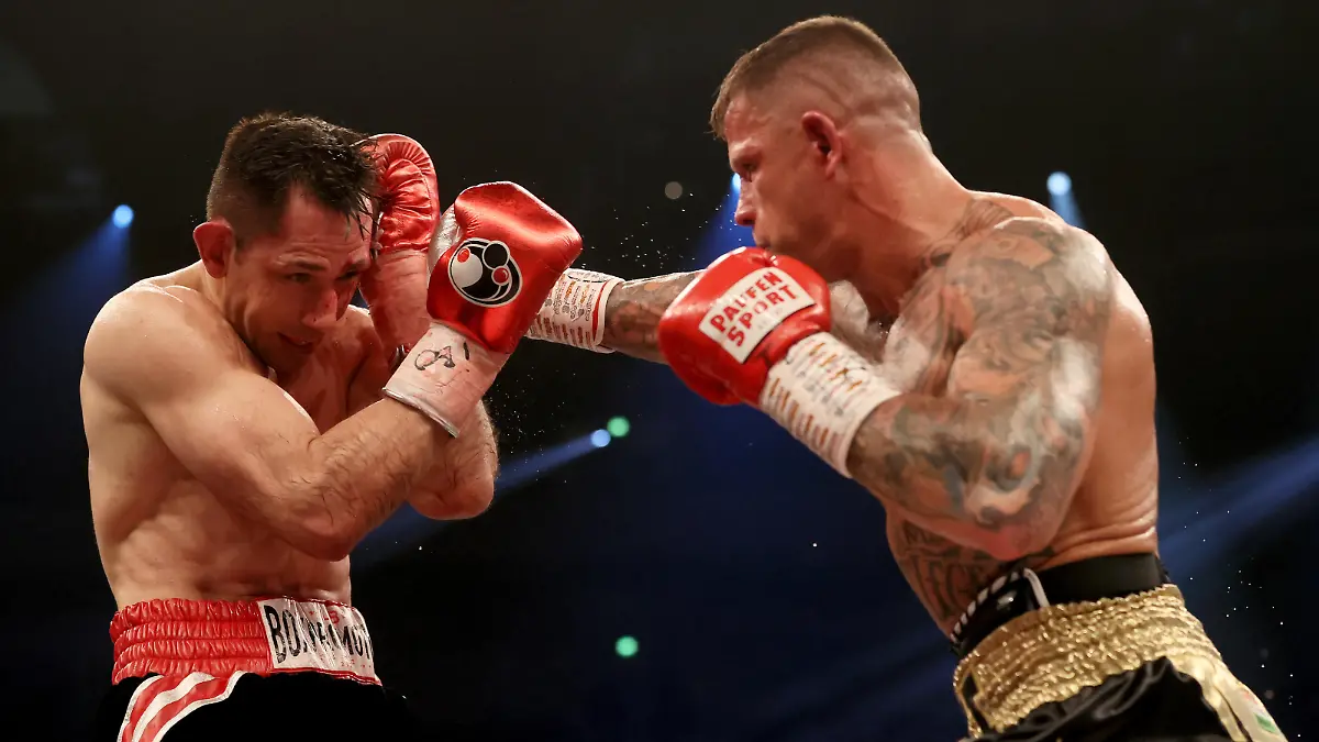 DORTMUND, GERMANY - MARCH 26: Felix Sturm (L) of Germany exchanges punches with Istvan Szili of Switzerland during the super middleweight fight between Felix Sturm and Istvan Szili at Westfalenhalle on March 26, 2022 in Dortmund, Germany. (Photo by Martin Rose/Getty Images)