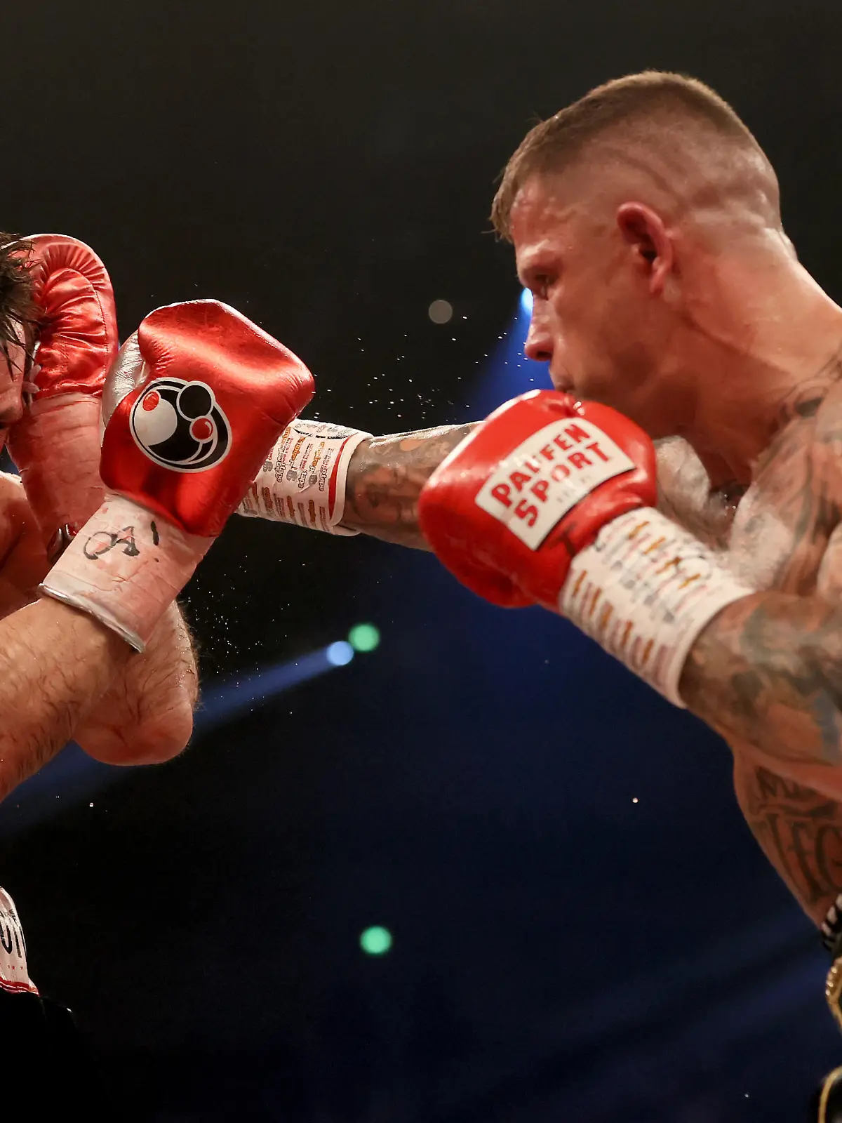 DORTMUND, GERMANY - MARCH 26: Felix Sturm (L) of Germany exchanges punches with Istvan Szili of Switzerland during the super middleweight fight between Felix Sturm and Istvan Szili at Westfalenhalle on March 26, 2022 in Dortmund, Germany. (Photo by Martin Rose/Getty Images)