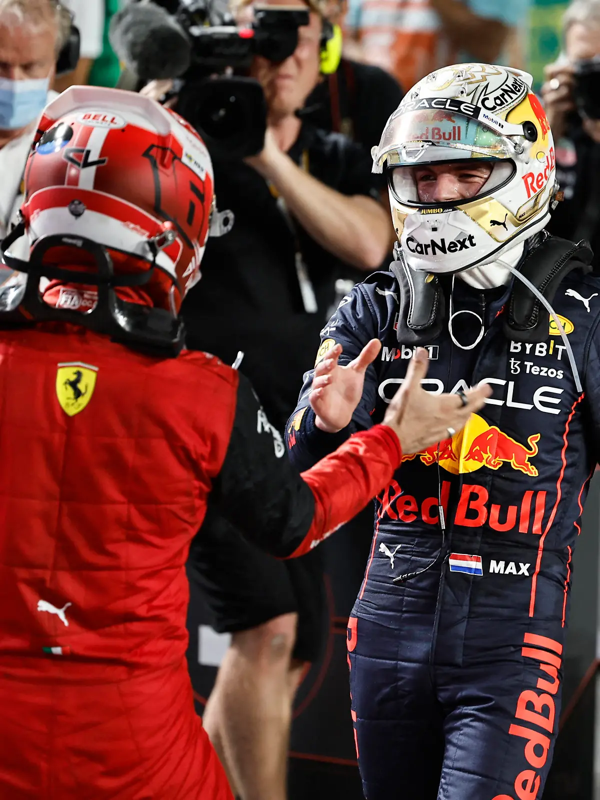 Formula One F1 - Saudi Arabia Grand Prix - Jeddah Corniche Circuit, Jeddah, Saudi Arabia - March 27, 2022 Red Bull's Max Verstappen celebrates winning the race with second placed Ferrari's Charles Leclerc REUTERS/Hamad I Mohammed