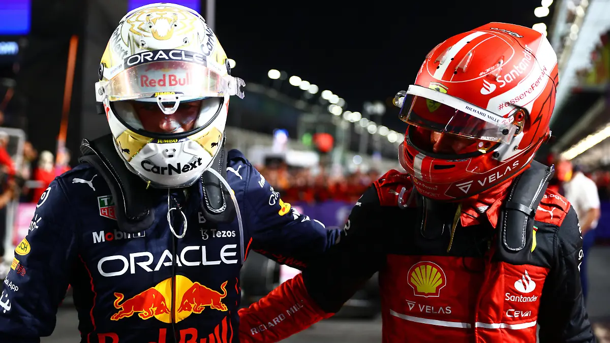 JEDDAH, SAUDI ARABIA - MARCH 27: Race winner Max Verstappen of the Netherlands and Oracle Red Bull Racing and Second placed Charles Leclerc of Monaco and Ferrari talk in parc ferme during the F1 Grand Prix of Saudi Arabia at the Jeddah Corniche Circuit on March 27, 2022 in Jeddah, Saudi Arabia. (Photo by Mark Thompson/Getty Images)
