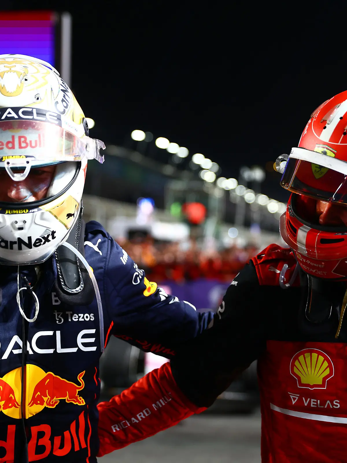 JEDDAH, SAUDI ARABIA - MARCH 27: Race winner Max Verstappen of the Netherlands and Oracle Red Bull Racing and Second placed Charles Leclerc of Monaco and Ferrari talk in parc ferme during the F1 Grand Prix of Saudi Arabia at the Jeddah Corniche Circuit on March 27, 2022 in Jeddah, Saudi Arabia. (Photo by Mark Thompson/Getty Images)