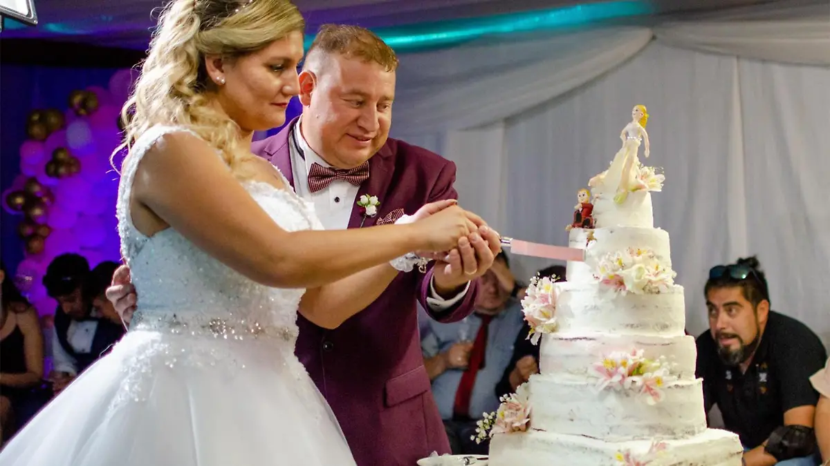 Story from Jam Press (Marijuana Wedding Cake)

Pictured: Alvaro Rodriguez's sister and husband cutting the marijuana cake at their wedding.

Man goes viral after baking sister ‘magical’ wedding cake laced with marijuana – leaving guests high as kites

A man has gone viral on TikTok after baking a wedding cake for his sister laced with marijuana – leaving guests high as kites.

Alvaro Rodriguez, 29, from Santiago, Chile, laced one of the seven tiers with cannabis – which is legal for private-at-home consumption – at his sister's big day last month. 

He spent 20 hours making and decorating the showpiece before dropping it off at the party venue. 

The video, which has racked up over 13 million views on TikTok, shows the bride and groom cutting into the traditional-looking cake to cheers from 100 guests. 

Footage then cuts to 20 of the 100 wedding guests dancing merrily and laughing as the effects kick in. 

The bride requested the fun cake after having a pleasant experience with “magical brownies”.

Alvaro uploaded a video showing the aftermath to TikTok, which racked up 13 million views and nearly two million likes, leaving viewers in stitches. 

One person said: "I'm definitely doing this on my wedding !!"

Another viewer wrote: "Hahahaha everyone flew literally haha."

"HAHAHA this is the best video I've ever seen,” said another fan. 

Others were left confused by the meaning of "magical cake" with one social media commenting: "I thought by magical he meant that it had glitter or something."

Some people even changed their attitudes to marriage after watching the video. 

One user said: "Ok, I didn't want to get married, but I see this, and I want to get married, then divorce, but already happy with my magical wedding cake jsjsj." [sic]

"It was good fun,” Alvaro told Jam Press.

"Me and my sister had already tried magical brownies and the effect was very funny, so when she asked to have a bit for her wedding I didn't think twice. 

"The magic