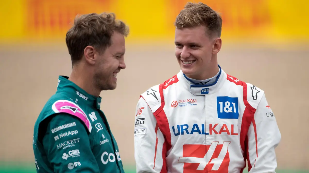 British Grand Prix - Preparation Day - Silverstone. (L to R): Sebastian Vettel (GER) Aston Martin F1 Team and Mick Schumacher (GER) Haas F1 Team - 2022 Car Launch. British Grand Prix, Thursday 15th July 2021. Silverstone, England. URN:60959297