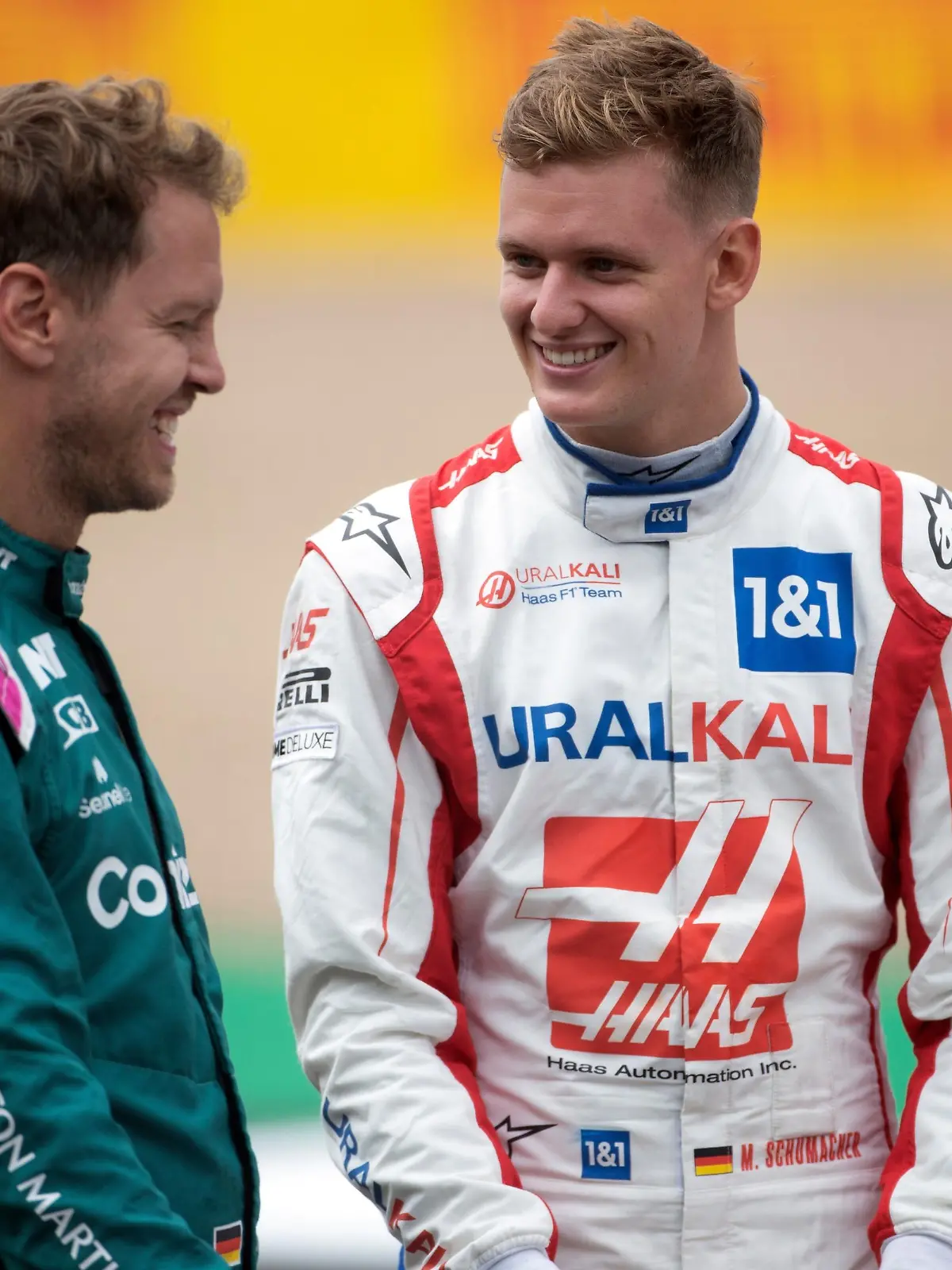 British Grand Prix - Preparation Day - Silverstone. (L to R): Sebastian Vettel (GER) Aston Martin F1 Team and Mick Schumacher (GER) Haas F1 Team - 2022 Car Launch. British Grand Prix, Thursday 15th July 2021. Silverstone, England. URN:60959297