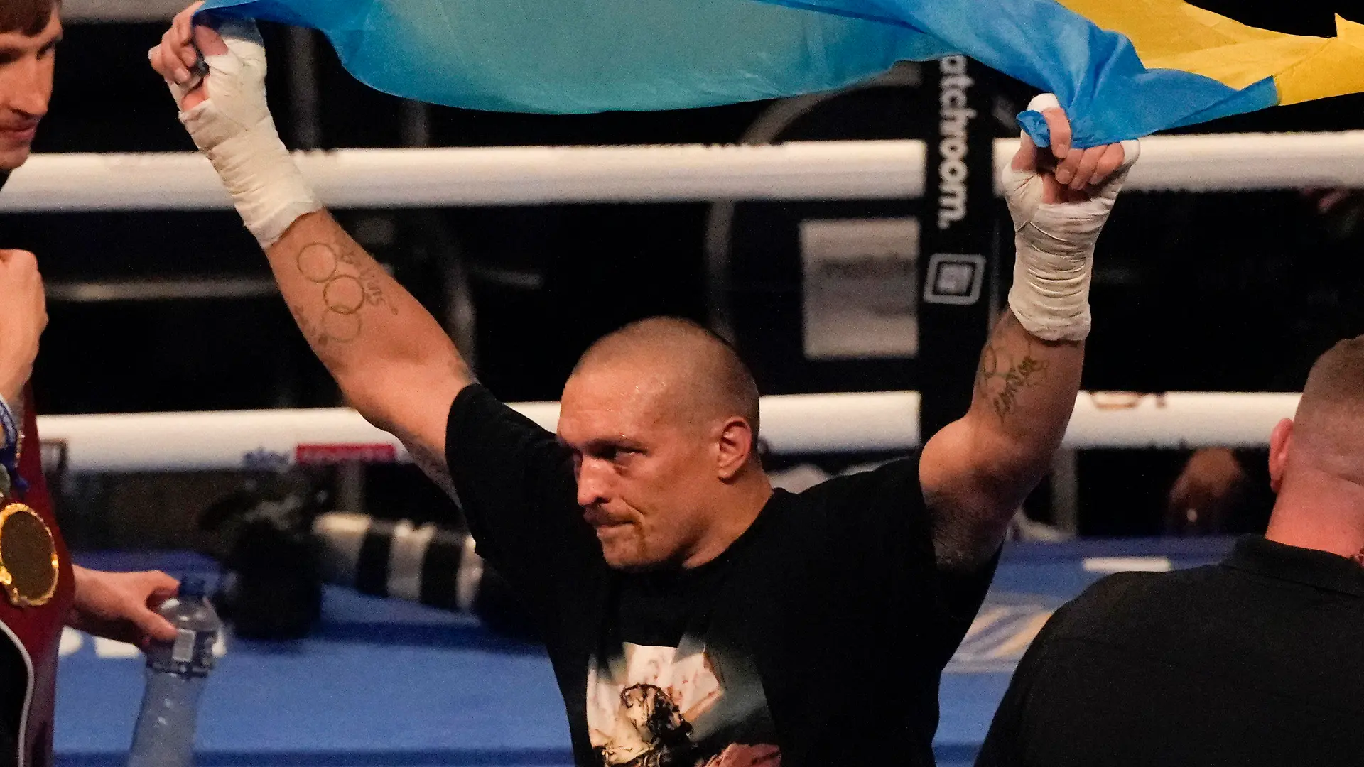 FILE - Oleksandr Usyk of Ukraine celebrates after his unanimous decision victory over Anthony Joshua of Britain in their WBA (Super), WBO and IBF boxing title bout at the Tottenham Hotspur Stadium in London, Saturday, Sept. 25, 2021. Former heavyweight champions Vitali and Wladimir Klitschko are leading some of the resistance from the mayor's office in beleaguered Kyiv. Two-time Olympic champion Vasiliy Lomachenko has an assault rifle and a place in a defense force, and current heavyweight champion Aleksandr Usyk rushed back home to take up arms against the Russians. Ukraine's rich boxing community is determined to fight, this time with guns instead of their fists. (AP Photo/Frank Augstein, File)