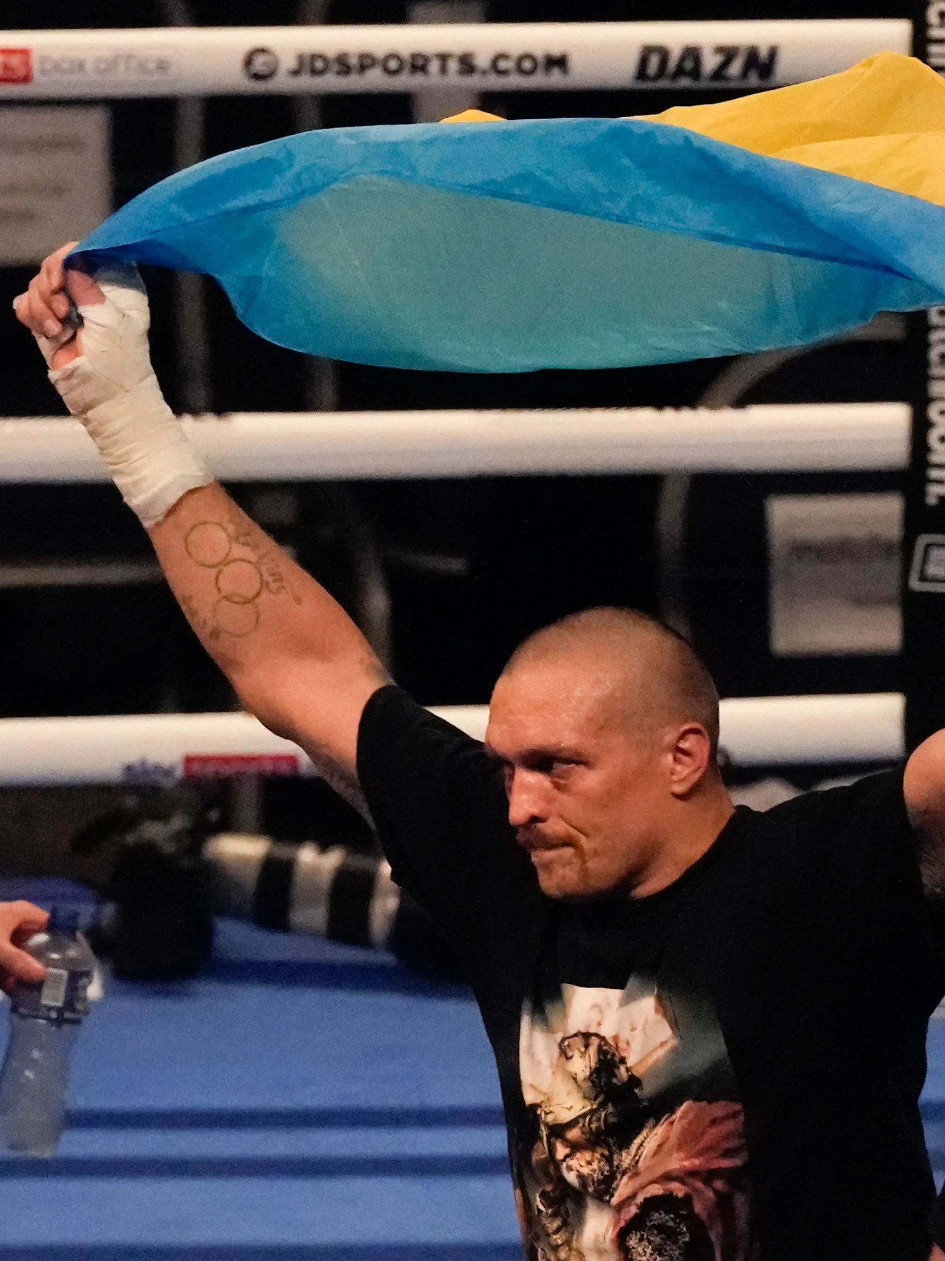 FILE - Oleksandr Usyk of Ukraine celebrates after his unanimous decision victory over Anthony Joshua of Britain in their WBA (Super), WBO and IBF boxing title bout at the Tottenham Hotspur Stadium in London, Saturday, Sept. 25, 2021. Former heavyweight champions Vitali and Wladimir Klitschko are leading some of the resistance from the mayor's office in beleaguered Kyiv. Two-time Olympic champion Vasiliy Lomachenko has an assault rifle and a place in a defense force, and current heavyweight champion Aleksandr Usyk rushed back home to take up arms against the Russians. Ukraine's rich boxing community is determined to fight, this time with guns instead of their fists. (AP Photo/Frank Augstein, File)