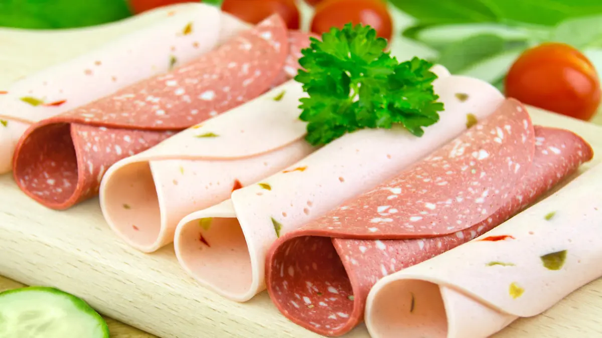 Vegetarian cold meat substitutes on wooden background