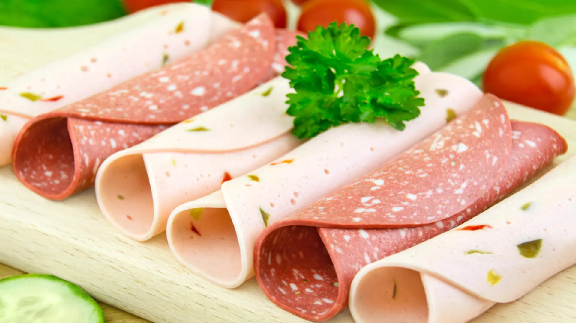 Vegetarian cold meat substitutes on wooden background